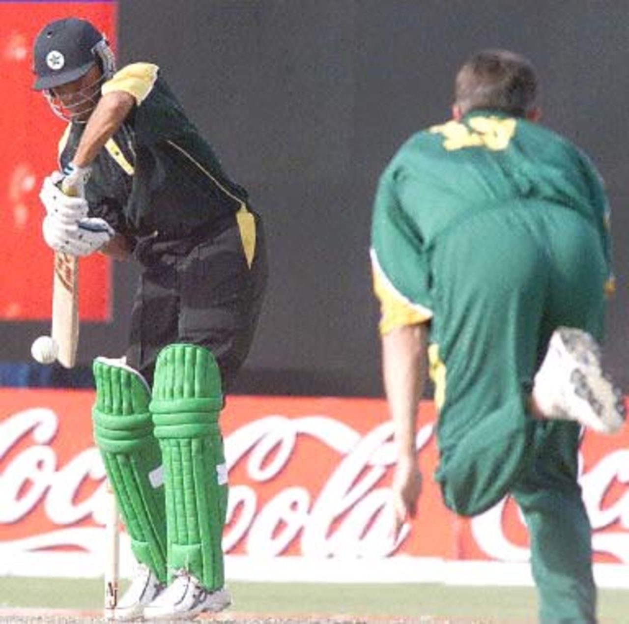 Pakistani batsman Waqar Younis in action against South African bowler Steve Elworthy  during the Champions Cup international at the Sharjah cricket stadium 24 March 2000.