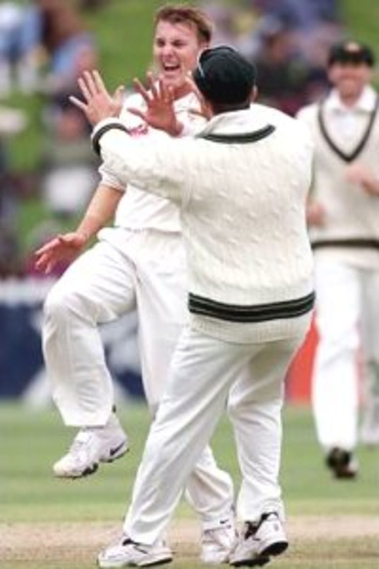26 Mar 2000: Brett Lee of Australia celebrates with team mate Michael Slater after bowling Mathew Sinclair of New Zealand for a duck, during day three of the second test between New Zealand and Australia at the Basin Reserve, Wellington, New Zealand.