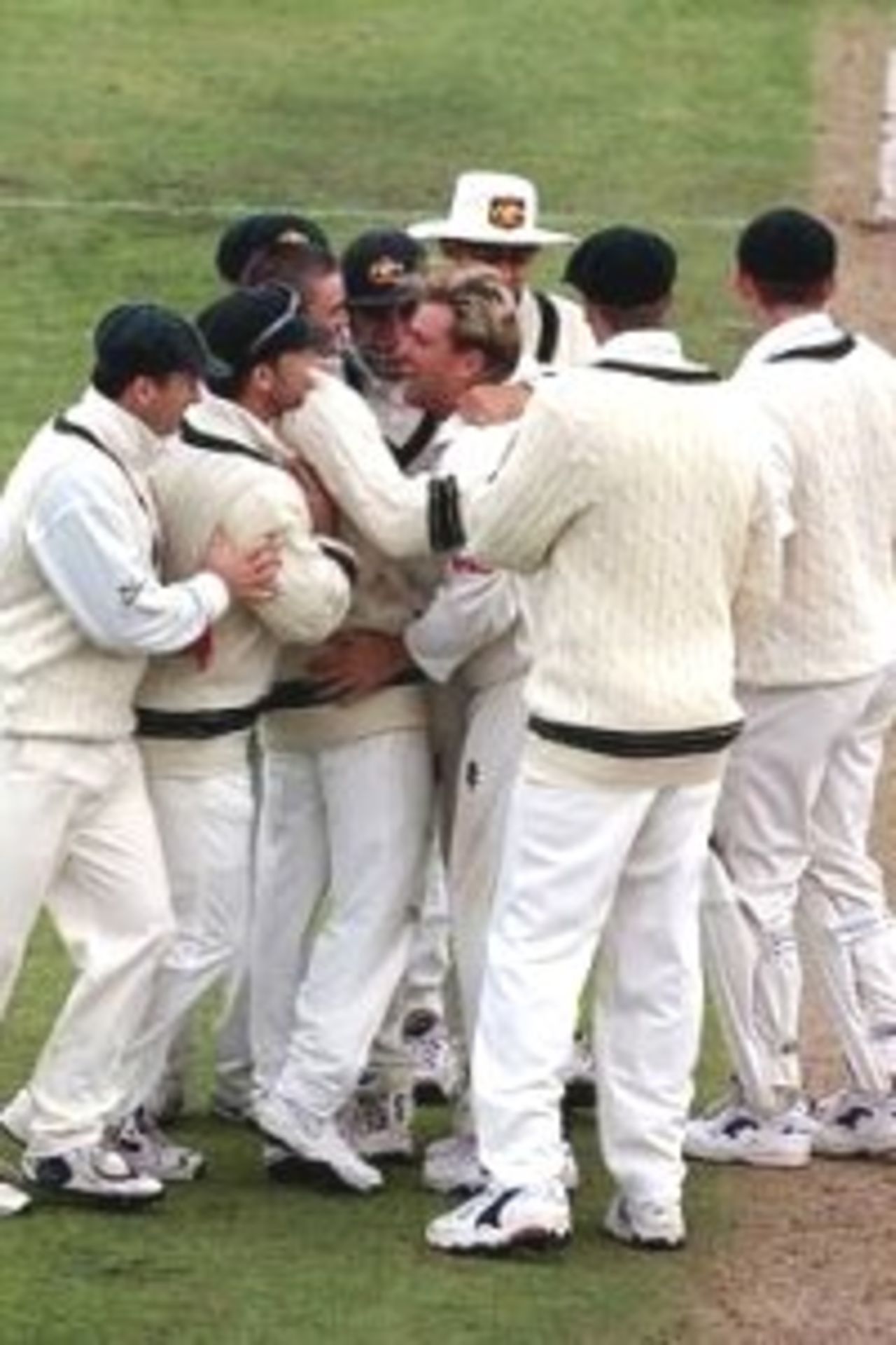 26 Mar 2000: Shane Warne of Australia is swarmed by team mates after bowling Nathan Astle of New Zealand, during day three of the second test between New Zealand and Australia at the Basin Reserve, Wellington, New Zealand.