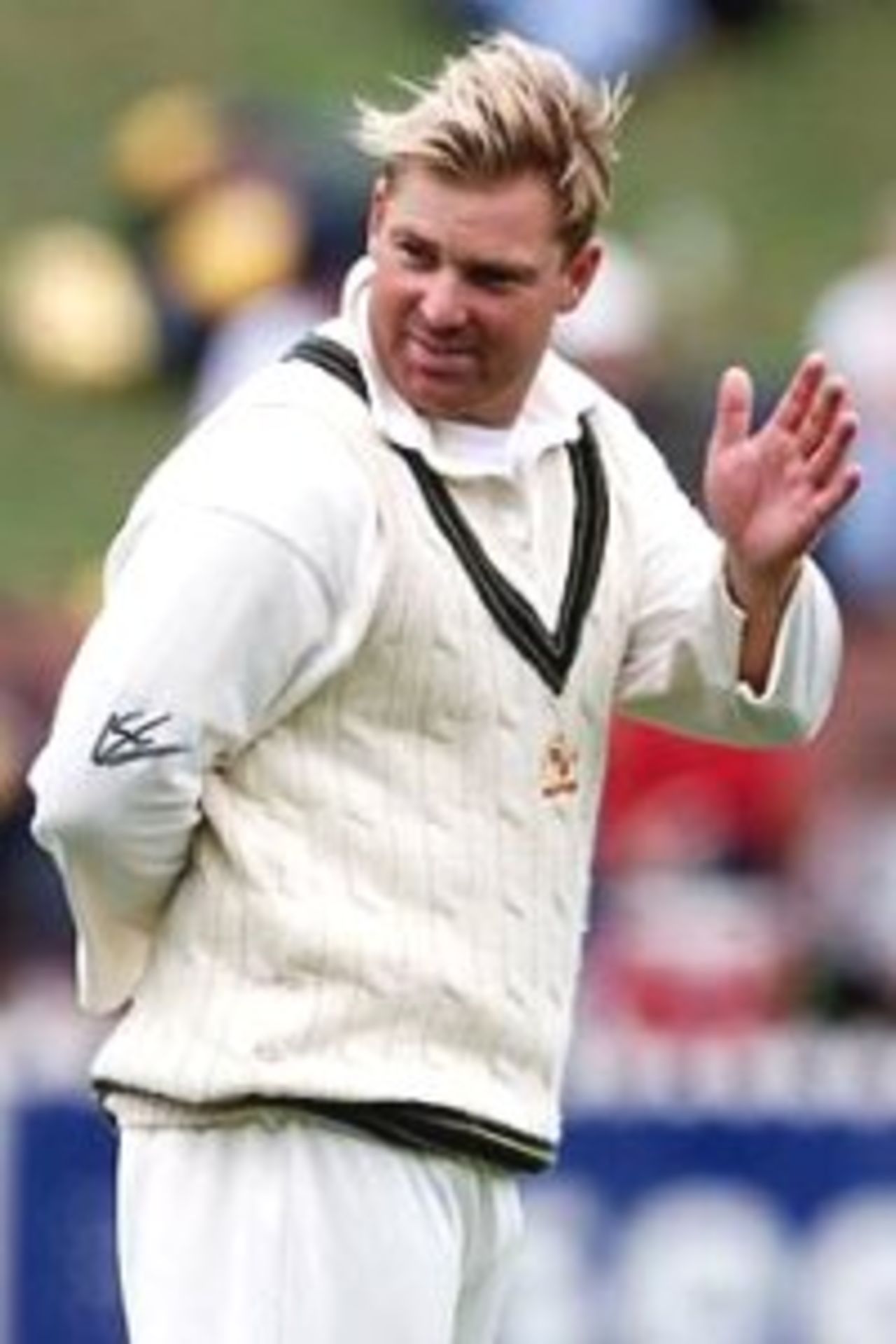 26 Mar 2000: Shane Warne of Australia waves to his daughter Brooke watching in the crowd, during day three of the second test between New Zealand and Australia at the Basin Reserve, Wellington, New Zealand.