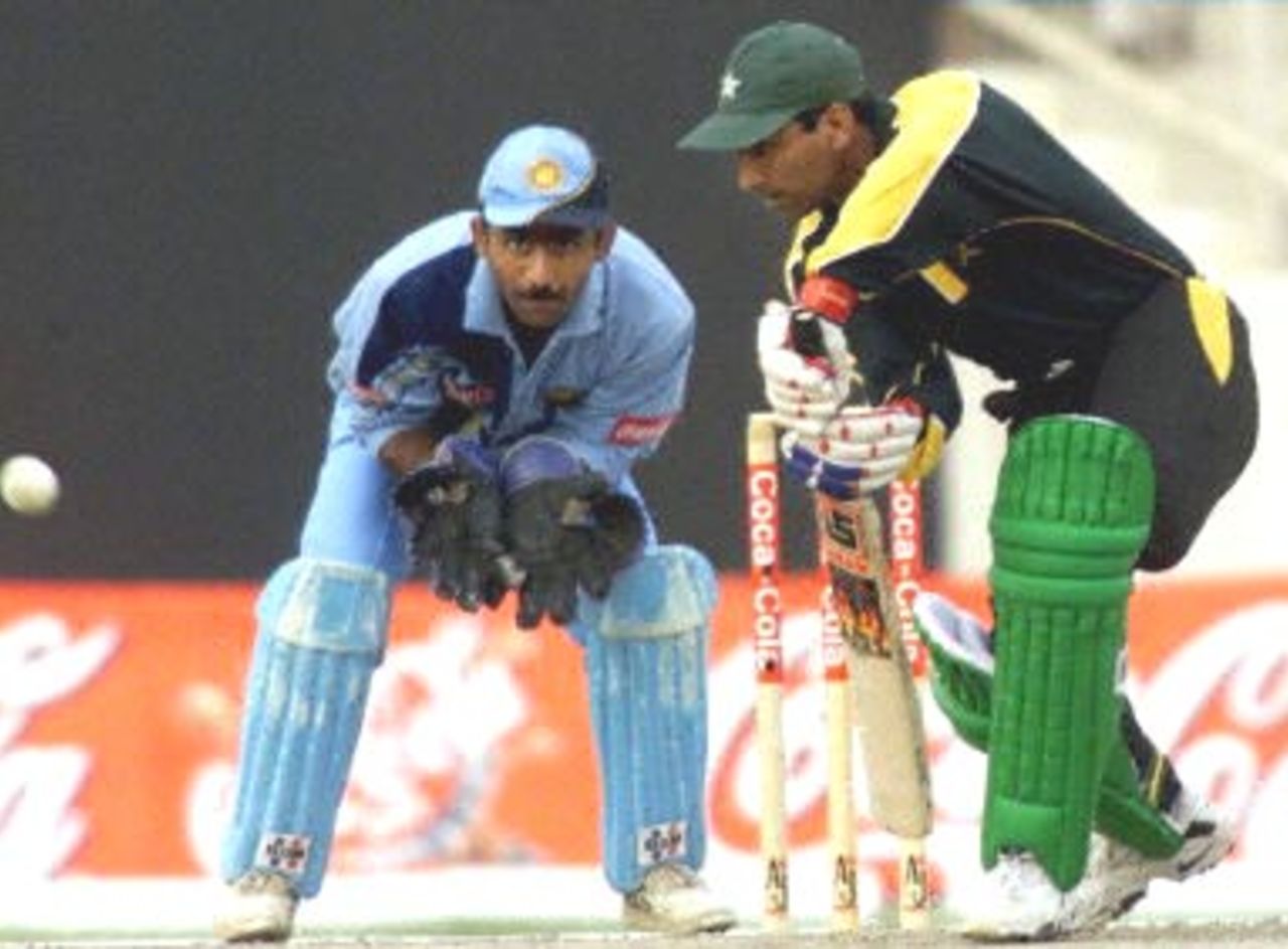 Pakistani batsman Yousuf Youhana (R) pushes the ball towards  cover point during the Champions Cup International at the Sharjah cricket stadium 26 March 2000.