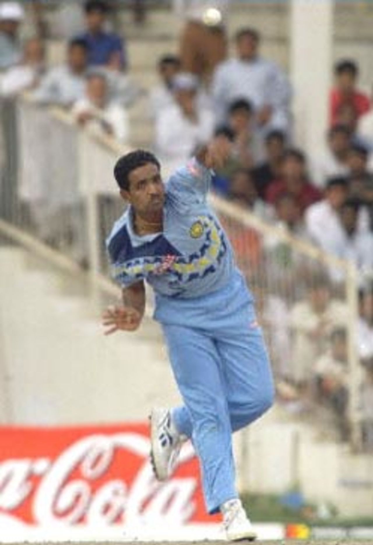 Indian bowler Sunil Joshi delivers the ball to Pakistani batsman Yusuf Youhana during their Champions Cup International game at the Sharjah cricket stadium 26 March 2000.