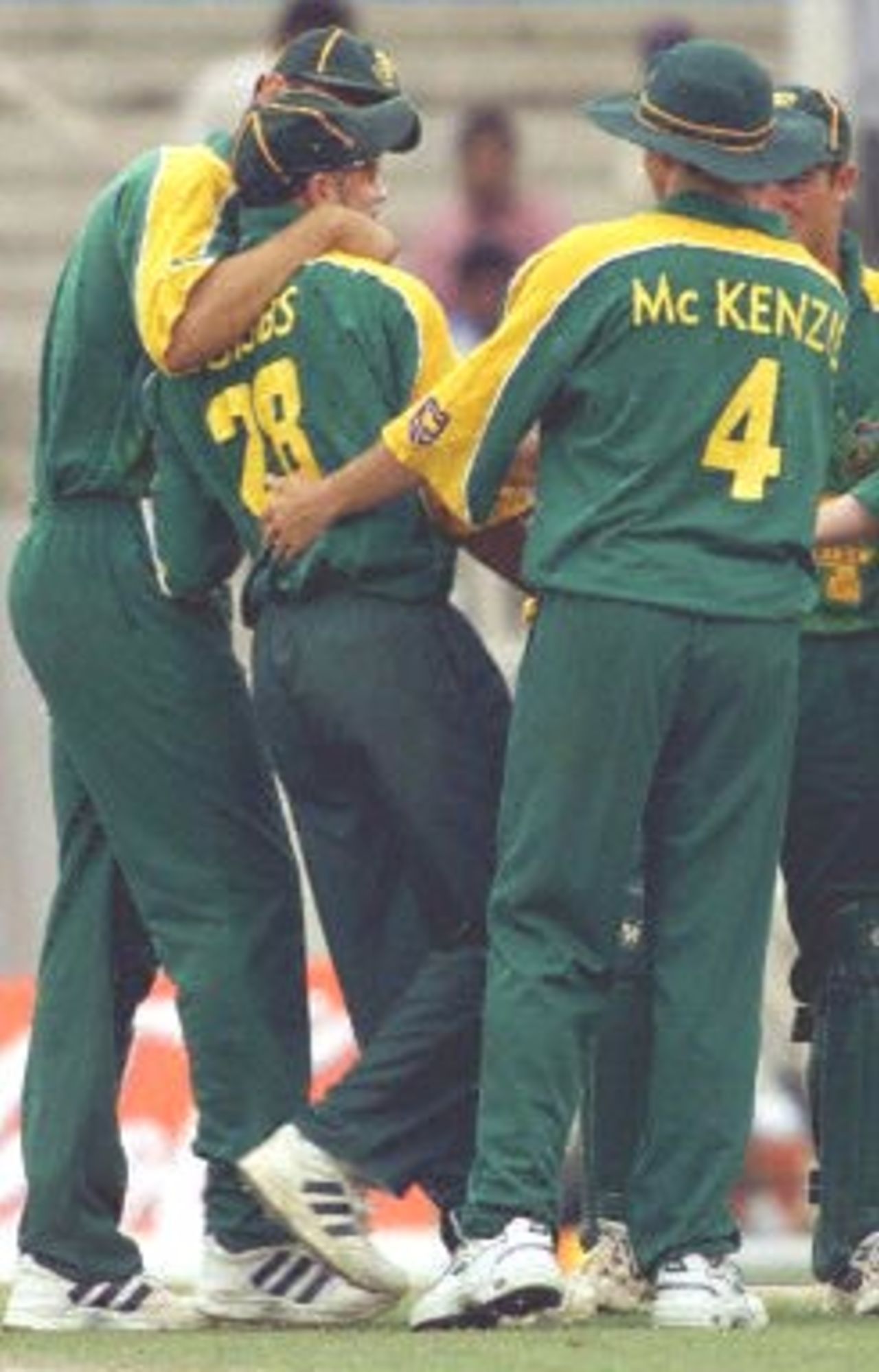 South Africa cricket players congratulate Herschelle Gibbs after he ran out Indian batsman Sachin Tendulkar at the three-nation Sharjah Cup, 27 March 2000.