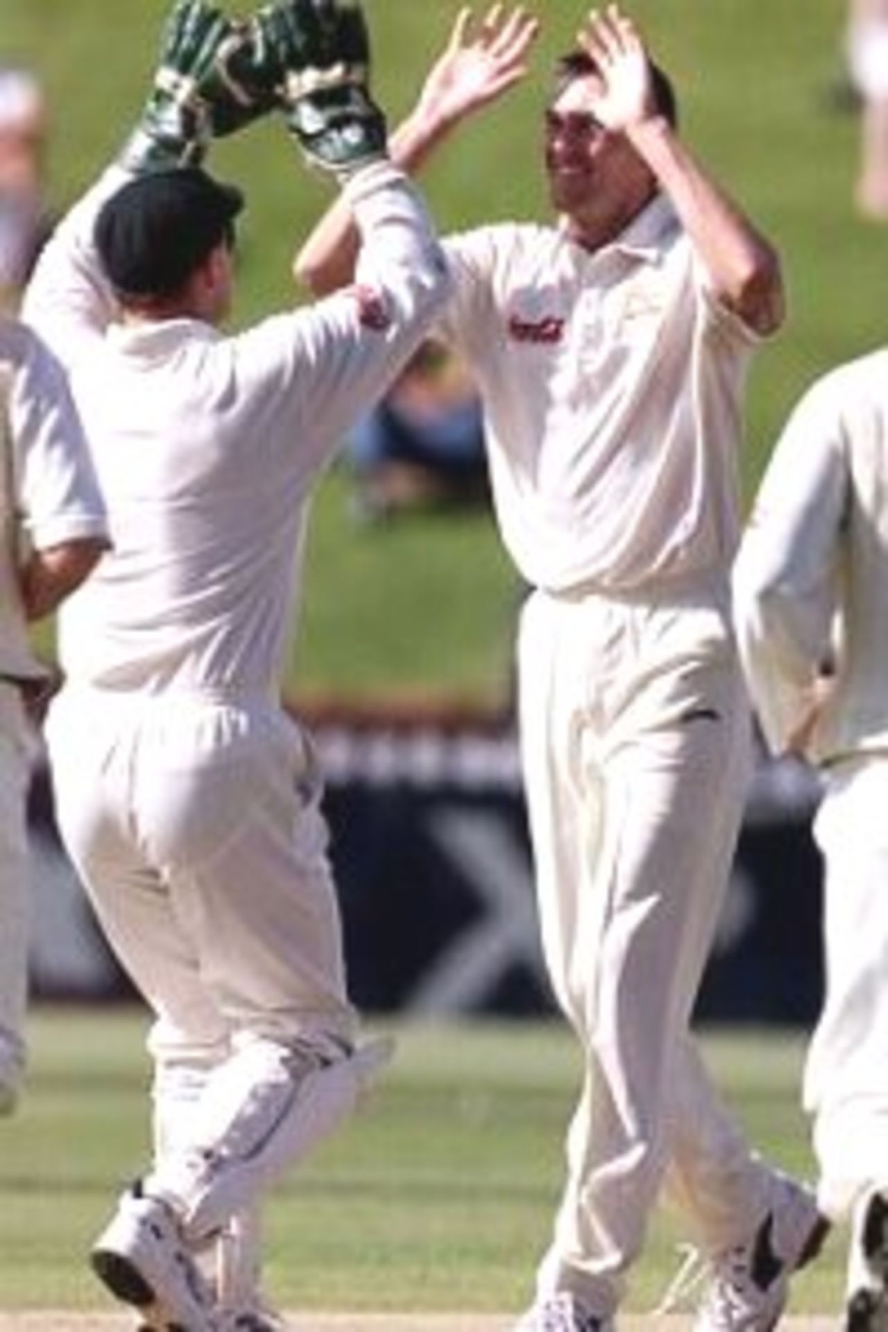 27 Mar 2000: Glenn McGrath (right) celebrates with team mate Adam Gilchrist after claiming the wicket of Chris Cairns of New Zealand LBW, during day four of the second test between New Zealand and Australia at the Basin Reserve, Wellington, New Zealand.