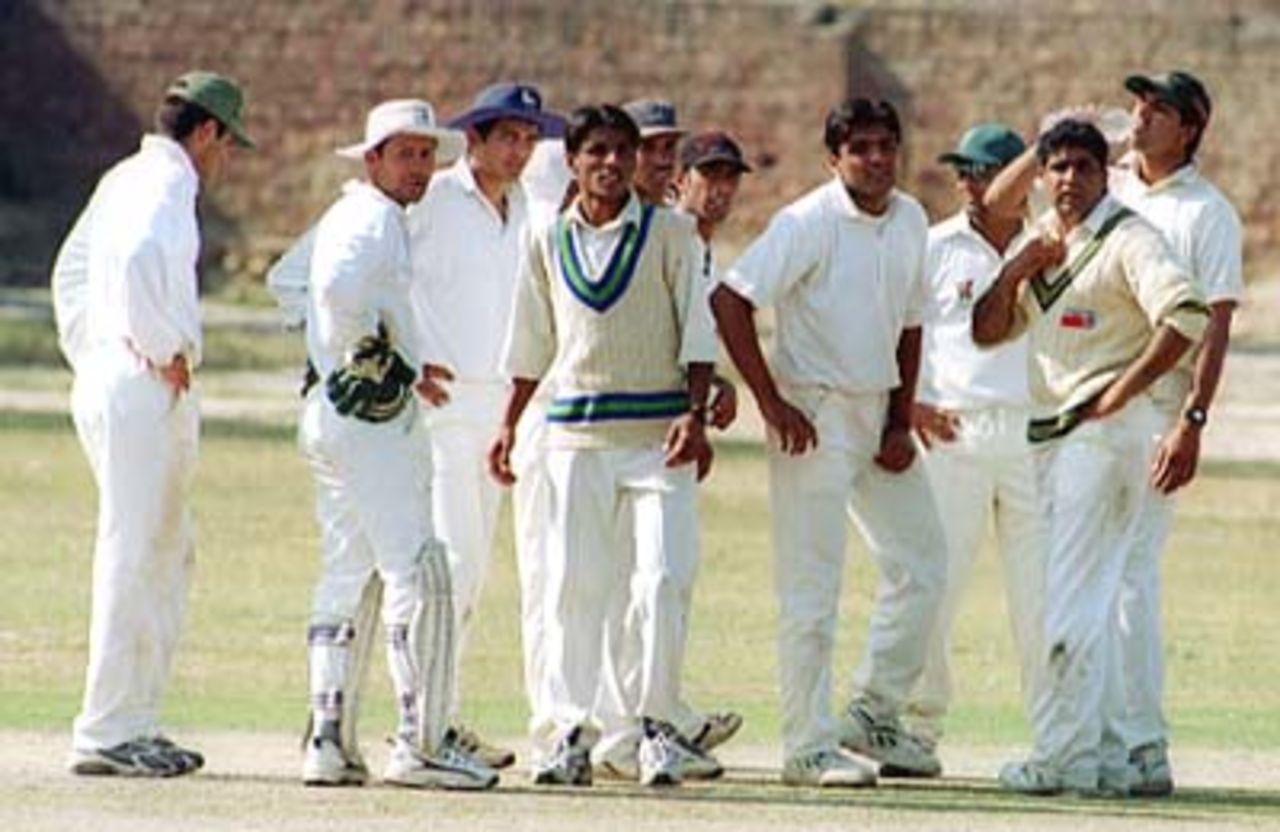 LCCA team wait for the arrival of next Bahawalpur batsman , LCCA Vs Bahawalpur at LCCA Ground Lahore,27 March 2000.