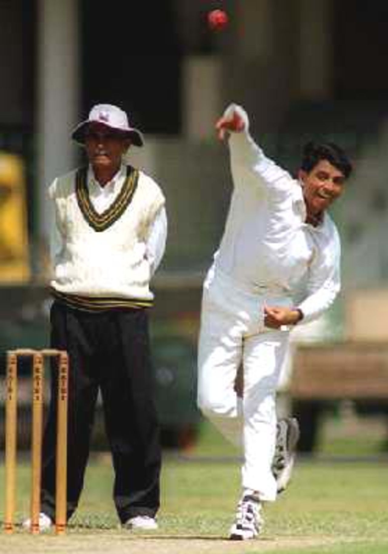 KCCA's Asad Ahmed bowls during the match against NBP NBP Vs KCCA at Gaddafi Stadium, Lahore,27 March 2000.