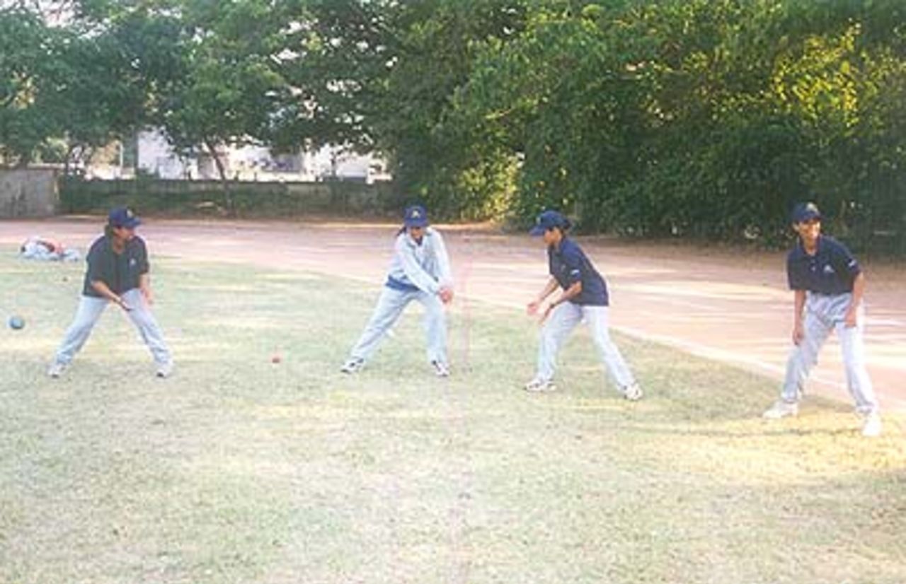 Air India players indulge in some catching practice at the University Union ground, 30 March 2000.