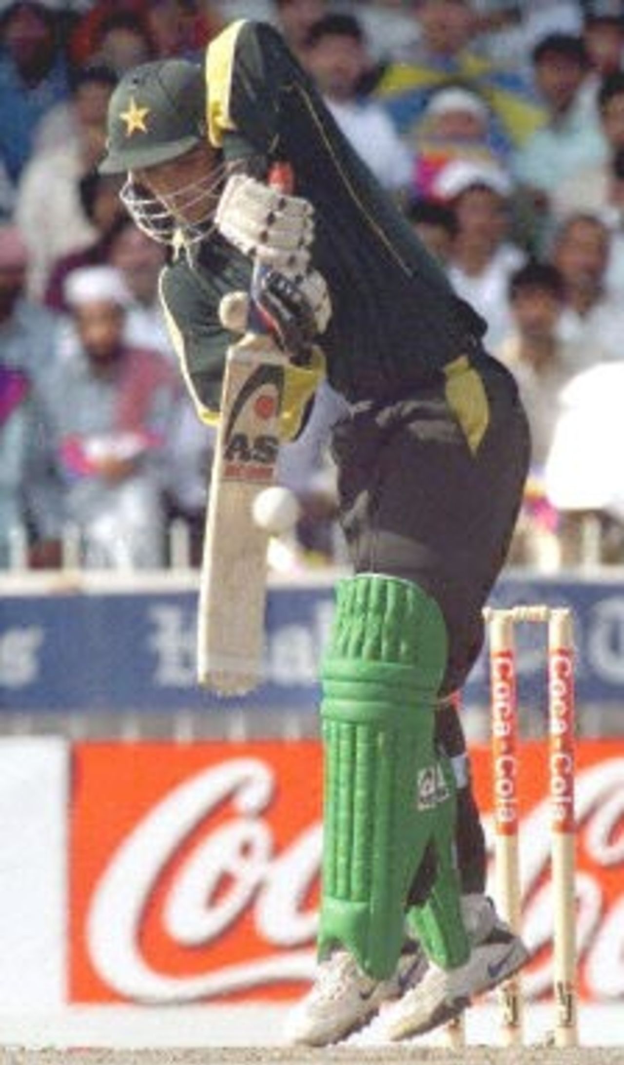 Pakistani batsman Younis Khan plays a defensive stroke to a ball from South African bowler  Jacques Kalis during the three-nation cricket Sharjah Cup final in  Sharjah 31 March 2000