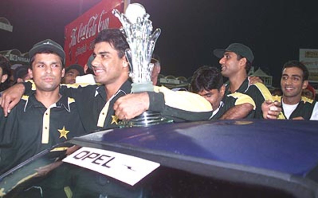 Waqar Younis and Moin Khan stand proudly near the car that Waqar walked away with at Sharjah, Pakistan v South Africa, Coca-Cola Cup 1999/00, Final, Sharjah C.A. Stadium, 31 March 2000.