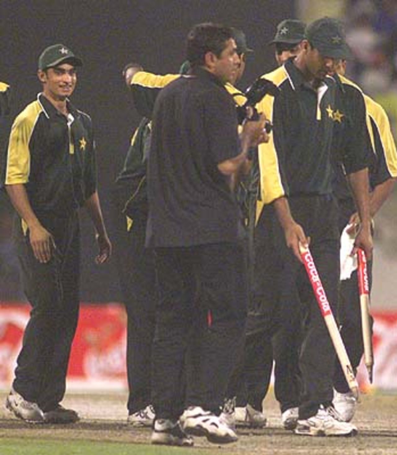 Victorious Pakistanis take stumps out of the ground as souvenirs of a thrilling victory Pakistan v South Africa, Coca-Cola Cup 1999/00, Final, Sharjah C.A. Stadium, 31 March 2000.