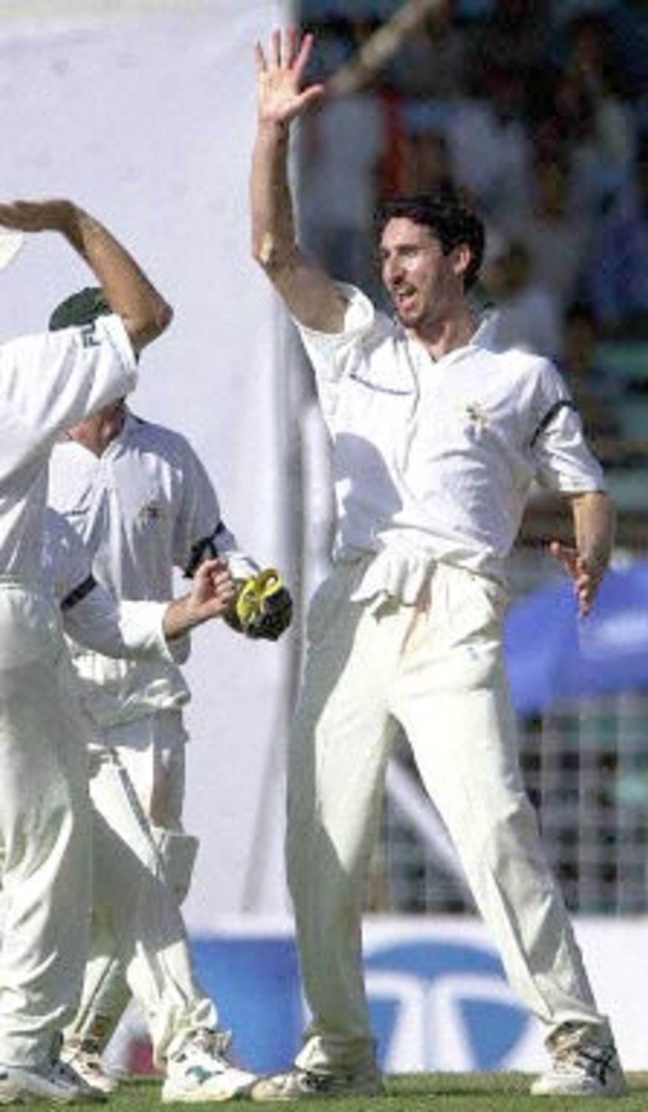 Australian pace bowler Jason Gillaspie celebrates with other team-mates after dismissing Indian opening batsman Shiv Sunder Das on the second day of the first test match between India and Australia at the Wankhade stadium in Bombay 28 February 2001. India were 58 for 2 at close of play in their second innings after conceding a 173 runs lead to Australia in the first innings.
