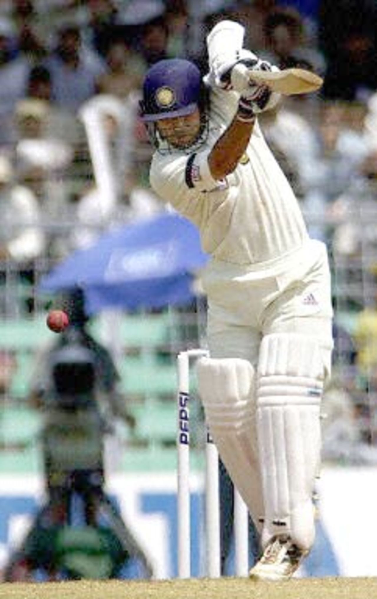 Indian batsman Sachin Tendulkar drives a delivery from Australian bowler Jason Gillespie to the fence on the third day of the first test match between India and Australia at the Wankhade stadium in Mumbai 01 March 2001. Tendulkar was playing at 61 runs to place India at a more comfortable 150 for 2 after conceding a 173 runs lead to Australia in the first innings.