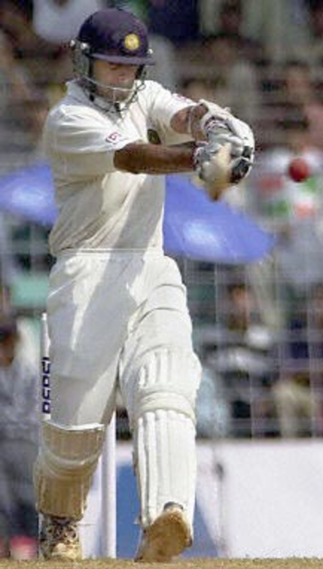 Indian batsman Rahul Dravid pulls a delivery from Australian pace bowler Damien Fleming to the fence on the third day of the first test match between India and Australia at the Wankhade stadium in Mumbai 01 March 2001. Dravid was unbeaten at 26 to place as India went to lunch without losing a wicket in the first two hours of play, after conceding a 173 runs lead to Australia in the first innings.