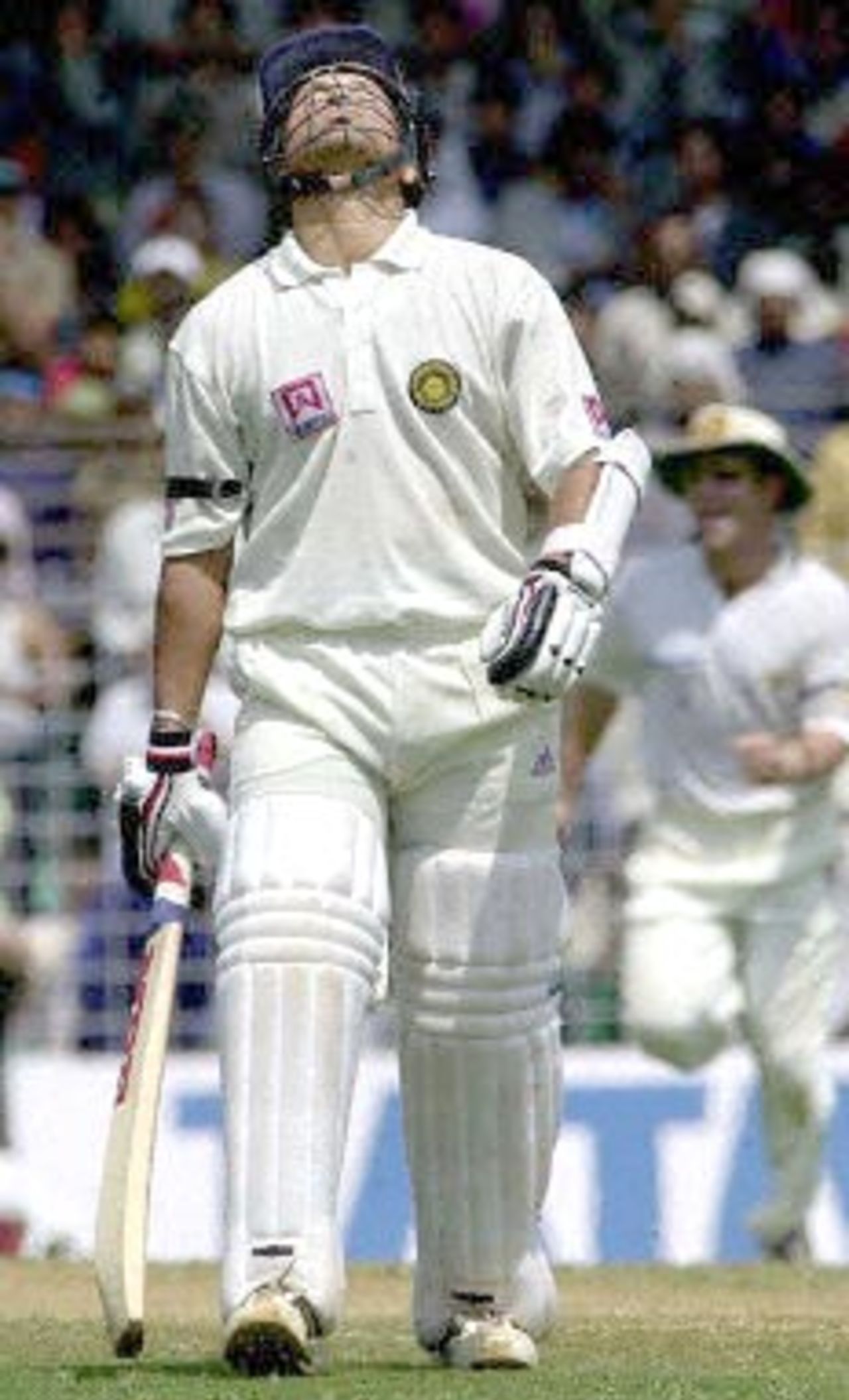 Indian ace batsman Sachin Tendulkar after being caught out for 65 runs off the bowling of Australian Mark Waugh on the third day of the first test match between India and Australia at the Wankhade stadium in Mumbai 01 March 2001. With the quick loss of Sachin Tendulkar and Indian captain Sourav Ganguly's wicket after lunch, India were in trouble at 56 for 4 after conceding a 173 runs lead to Australia in the first innings.