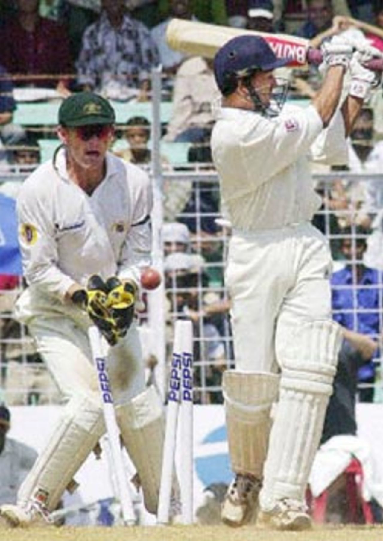 Indian batsman Ajit Agarkar is bowled off the bowling of Australian Mark Waugh for zero runs as Australian wicketkeeper Adam Gilchrist (L) looks on during the third day's play of the first Test match between India and Australia at the Wankhede stadium in Mumbai 01 March 2001. India were in deep trouble at 206 for 7 at tea and face an almost certain defeat.