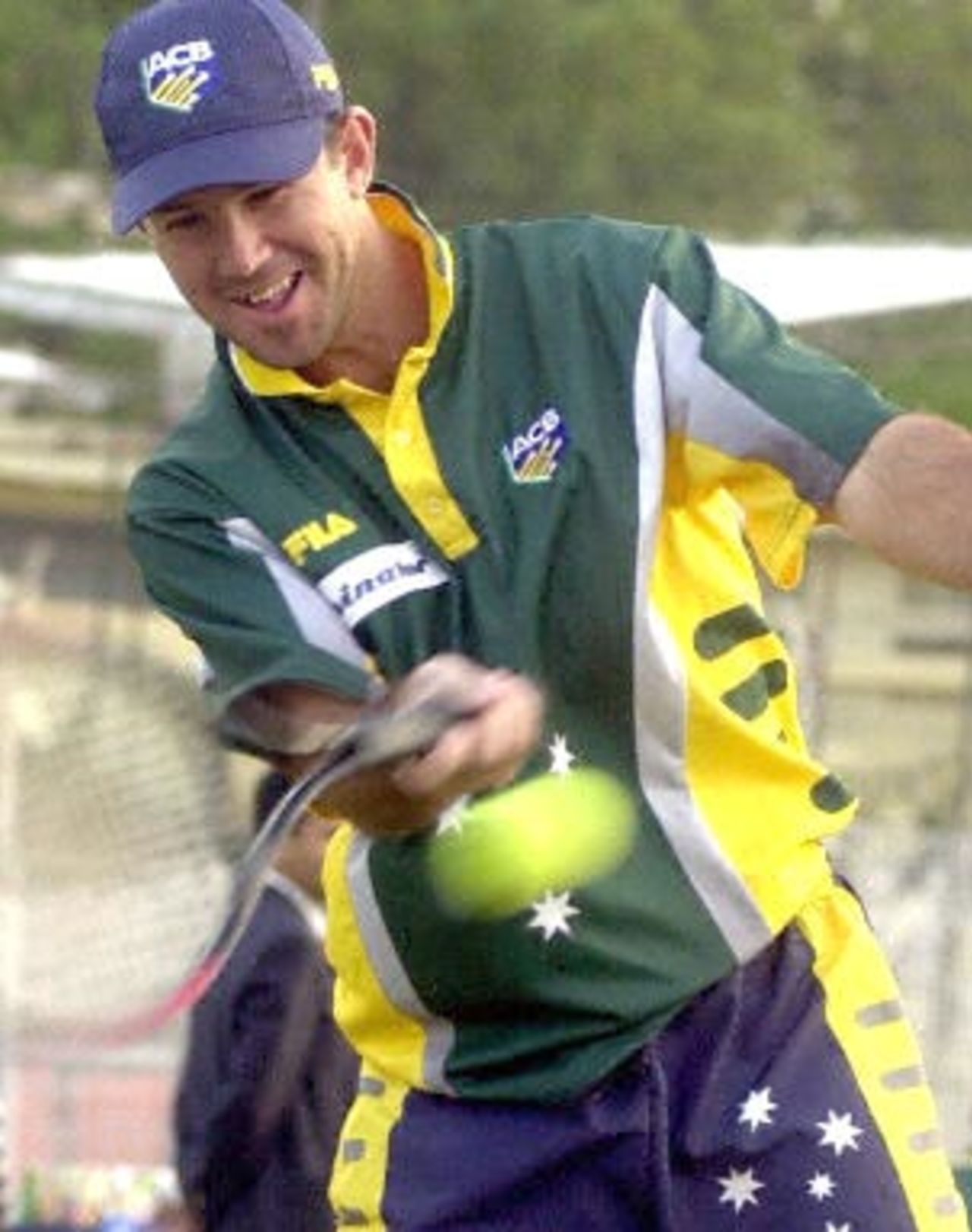 Australian cricket player Ricky Ponting enjoys a session of friendly tennis with teammate Damien Martyn (not pictured) during a net practice session by the Australian team at the Ferozshah Kotla ground in New Delhi, 04 March 2001. Australia will be playing India's Board President's XI team from 06 March 2001 after having already taken a 1-0 lead in the three Test match series against India.