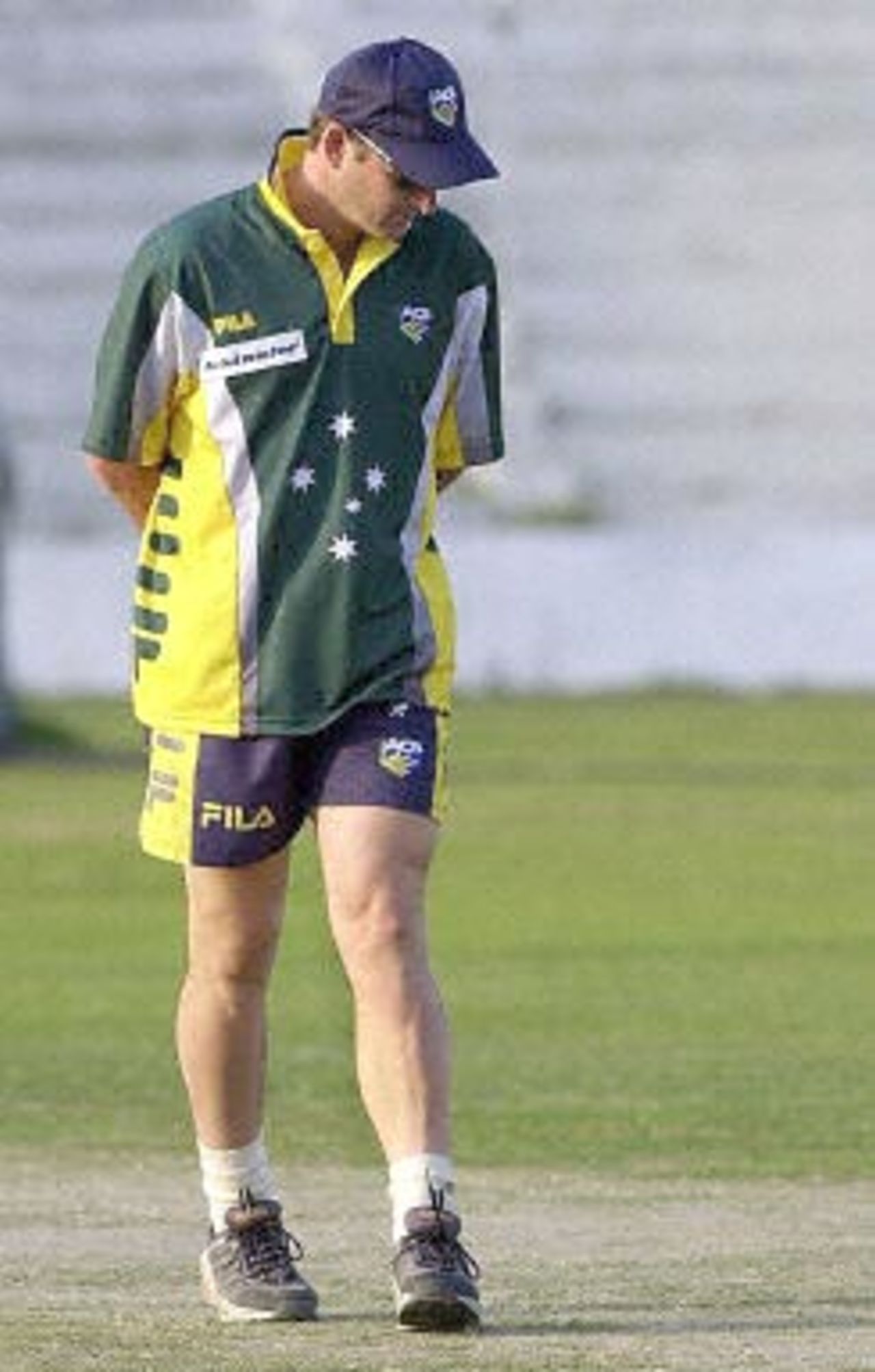 Australian star batsman Mark Waugh inspects the pitch at the Ferozshah Kotla ground in New Delhi during a net-practice session by the Australian team, 04 March 2001. Australia will be playing India's Board President's XI team from 06 March 2001 after having already taken a 1-0 lead in the three Test match series against India.