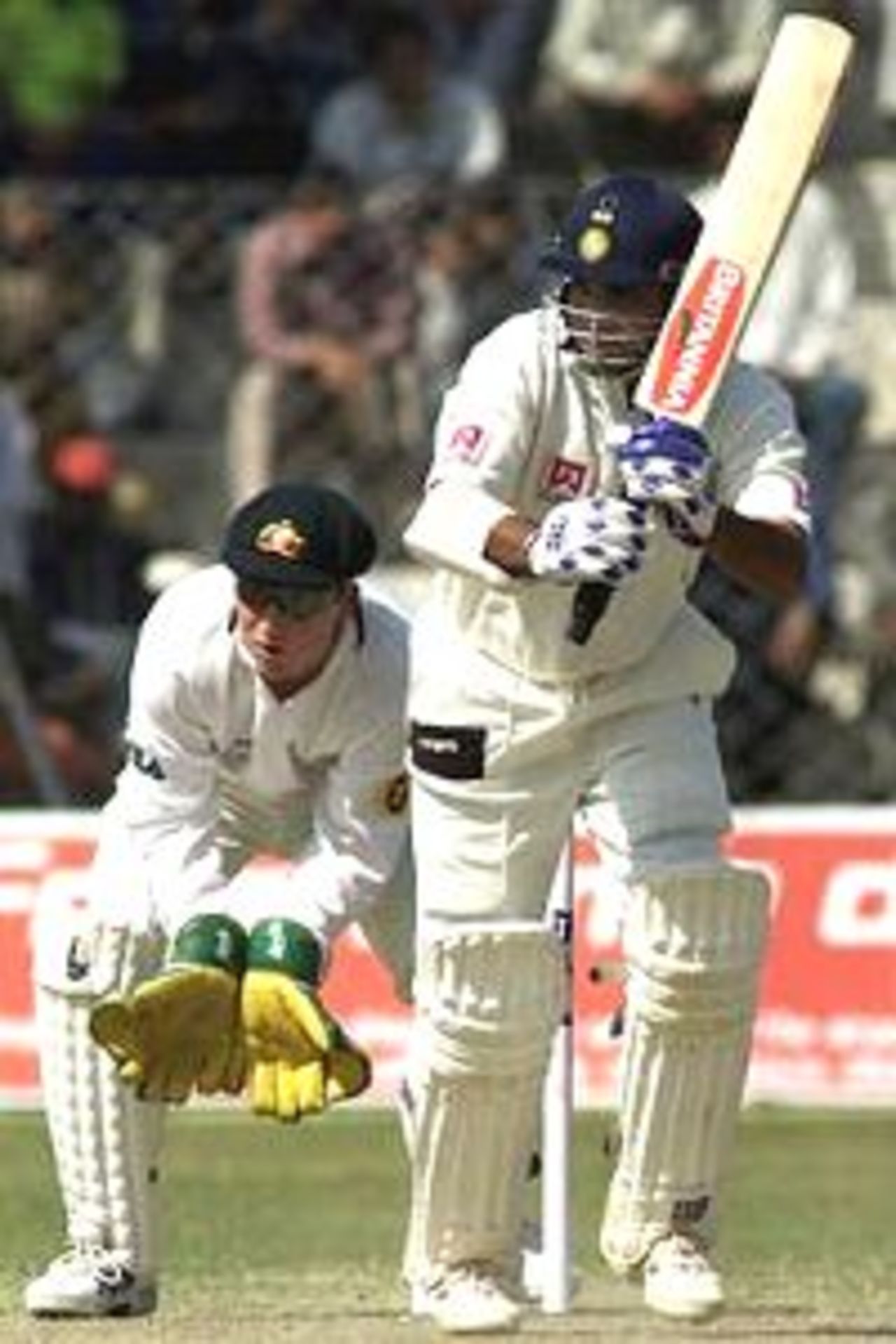 Saurav Ganguly of BP XI drives with Brad Haddin of Australia looking on, during day two of the three day match between the Board President's XI and Australia played at Frazshaha Kotla Ground, New Delhi, India.