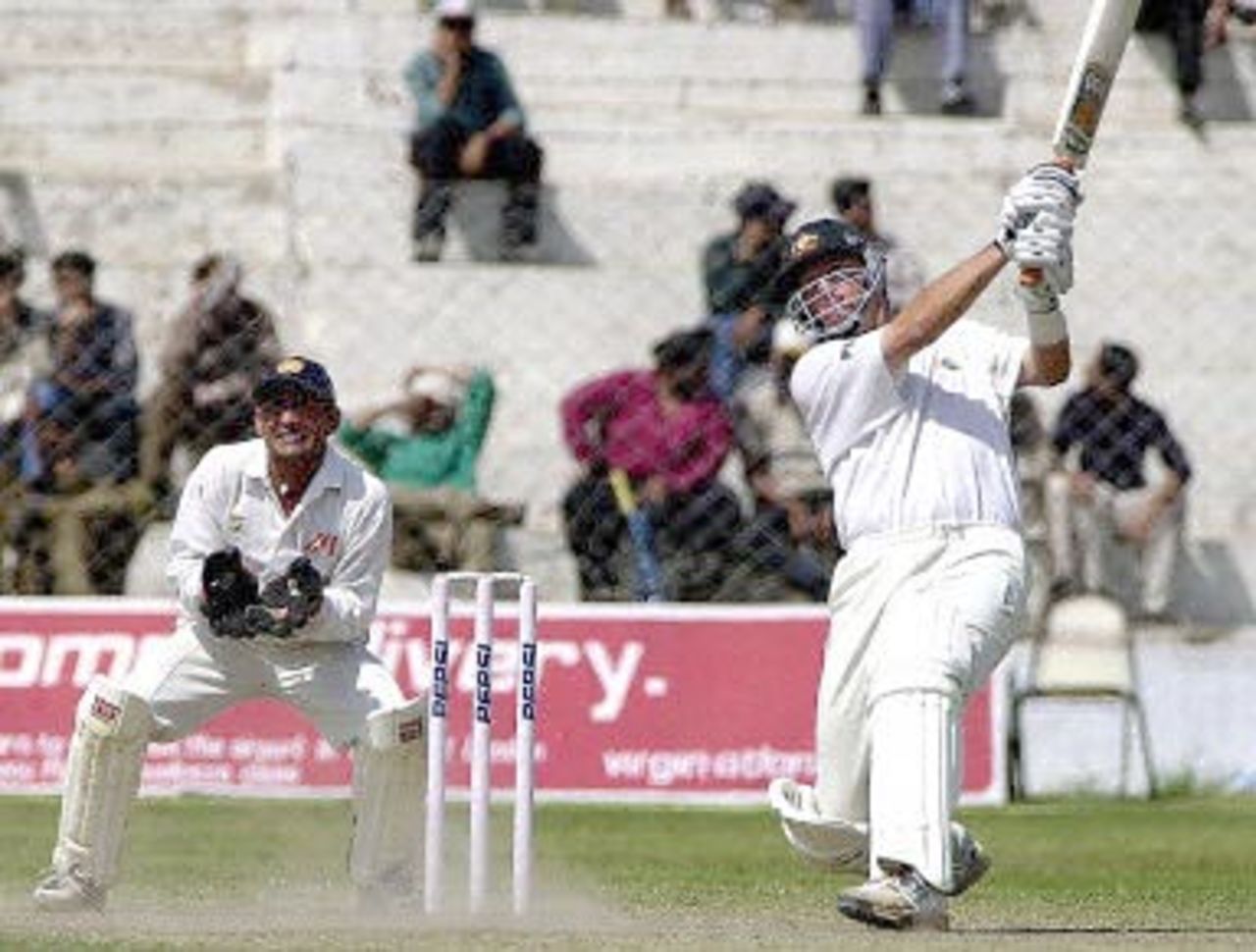 Australia's top scorer Mark Waugh hits a ball for six runs on his way to 150 during their second innings during a three-day match against Board President's XI in New Delhi 08 March 2001. Waugh scored 164, but the match ended in a draw.