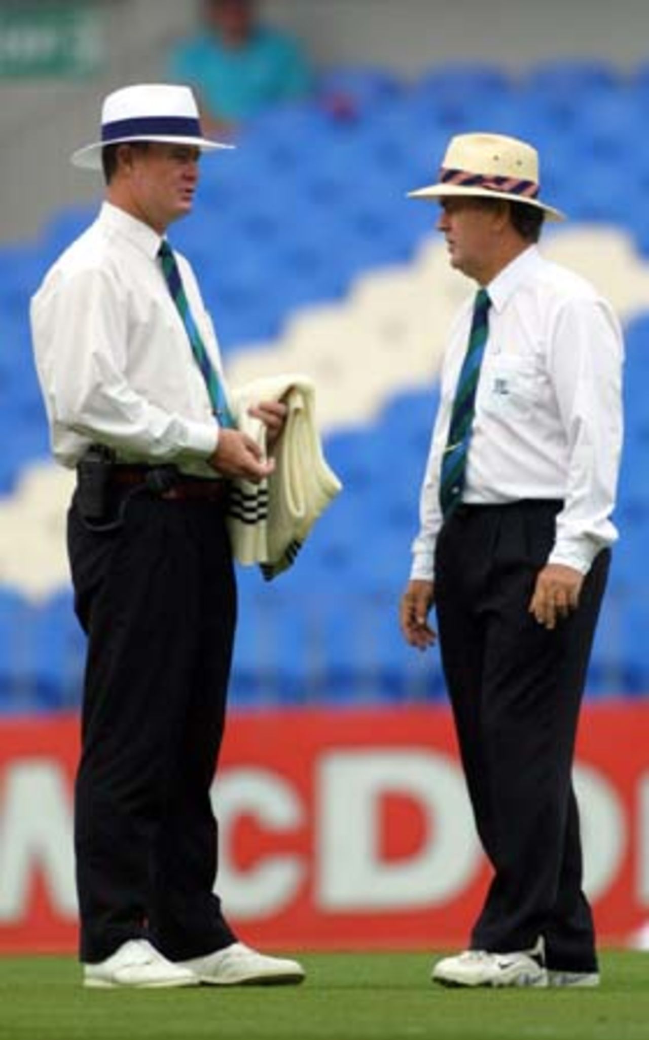 Umpires Russell Tiffin and Doug Cowie discuss the situation as rain falls on the second morning. 1st Test: New Zealand v Pakistan at Eden Park, Auckland, 8-12 March 2001 (9 March 2001).