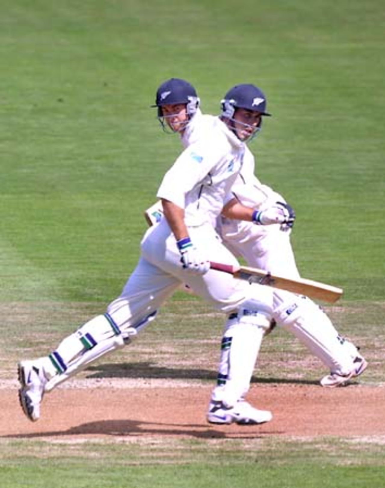 New Zealand batsmen Craig McMillan and Stephen Fleming cross paths during a run. The pair added 111 for the fifth wicket in New Zealand's first innings. 1st Test: New Zealand v Pakistan at Eden Park, Auckland, 8-12 March 2001 (10 March 2001).