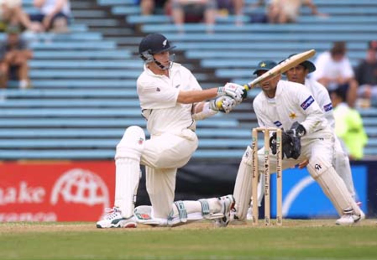 New Zealand lower order batsman Paul Wiseman sweeps a ball from Pakistan off spinner Saqlain Mushtaq through backward square leg during his first innings of nine. Wicket-keeper Moin Khan and slip fielder Misbah-ul-Haq look on. 1st Test: New Zealand v Pakistan at Eden Park, Auckland, 8-12 March 2001 (10 March 2001).