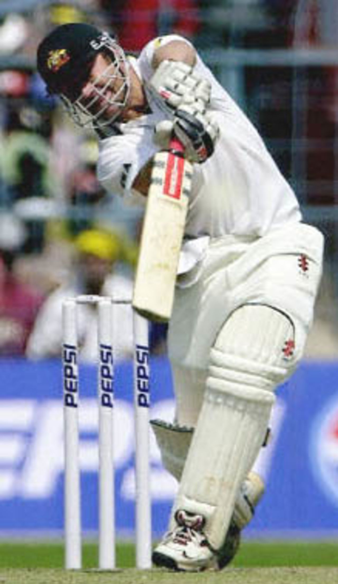11 Mar 2001: Australian opening batsman Michael Slater drives a delivery from India's pace bowler Zaheer Khan to the boundary on his way to scoring an unbeaten 41 runs before lunch on the first day of the second Test at Kolkata.