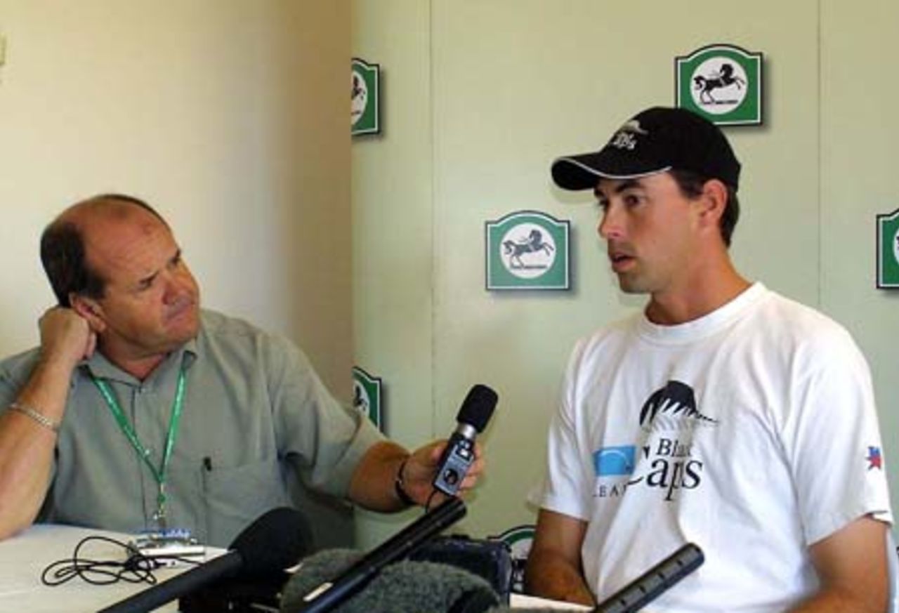 New Zealand captain Stephen Fleming speaks during the post-match press conference after New Zealand lost by 299 runs, while radio commentator Bryan Waddle listens. 1st Test: New Zealand v Pakistan at Eden Park, Auckland, 8-12 March 2001 (12 March 2001).