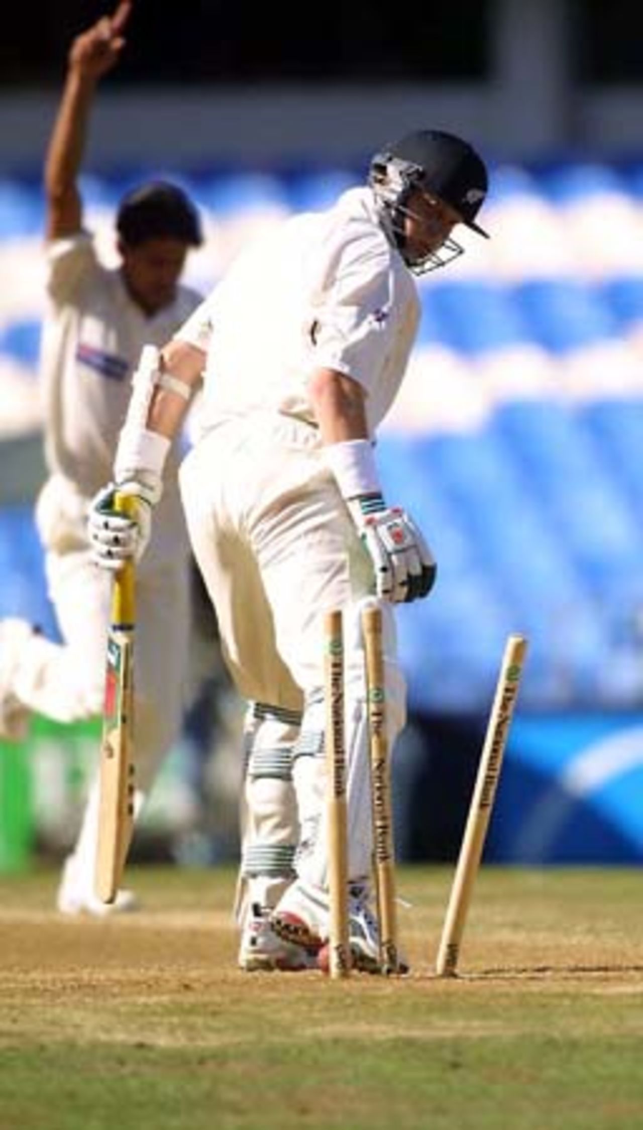 New Zealand nightwatchman Paul Wiseman looks back to see the stumps knocked back after being bowled by Pakistan fast bowler Mohammad Sami for eight. 1st Test: New Zealand v Pakistan at Eden Park, Auckland, 8-12 March 2001 (12 March 2001).