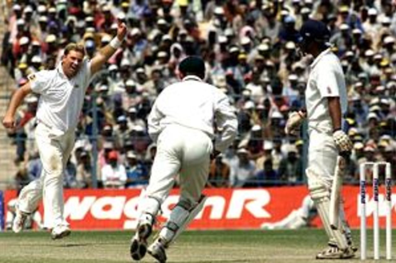 Shane Warne of Australia claims the wicket of Sadagoppan Ramesh of India, caught by Matthew Hayden for 30, during day three of the 2nd Test between India and Australia played at Eden Gardens, Calcutta, India.