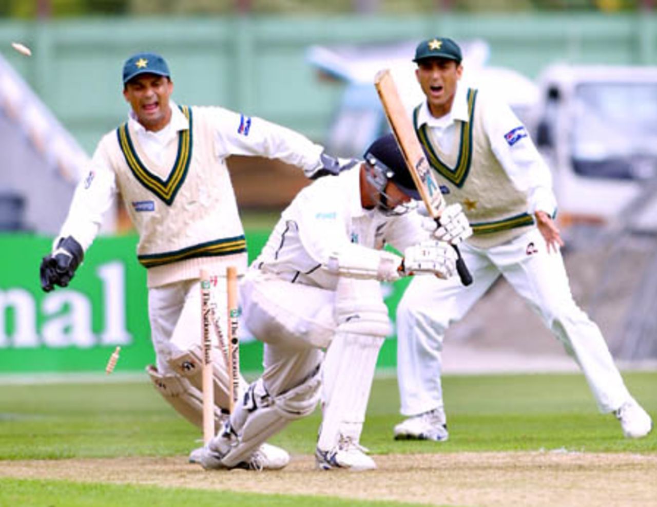 New Zealand opening batsman Mark Richardson leaves a ball from Pakistan off spinner Saqlain Mushtaq, only to be bowled for 46 in his first innings. Wicket-keeper Moin Khan and slip fielder Younis Khan look on in celebration. 2nd Test: New Zealand v Pakistan at Jade Stadium, Christchurch, 15-19 March 2001 (15 March 2001).