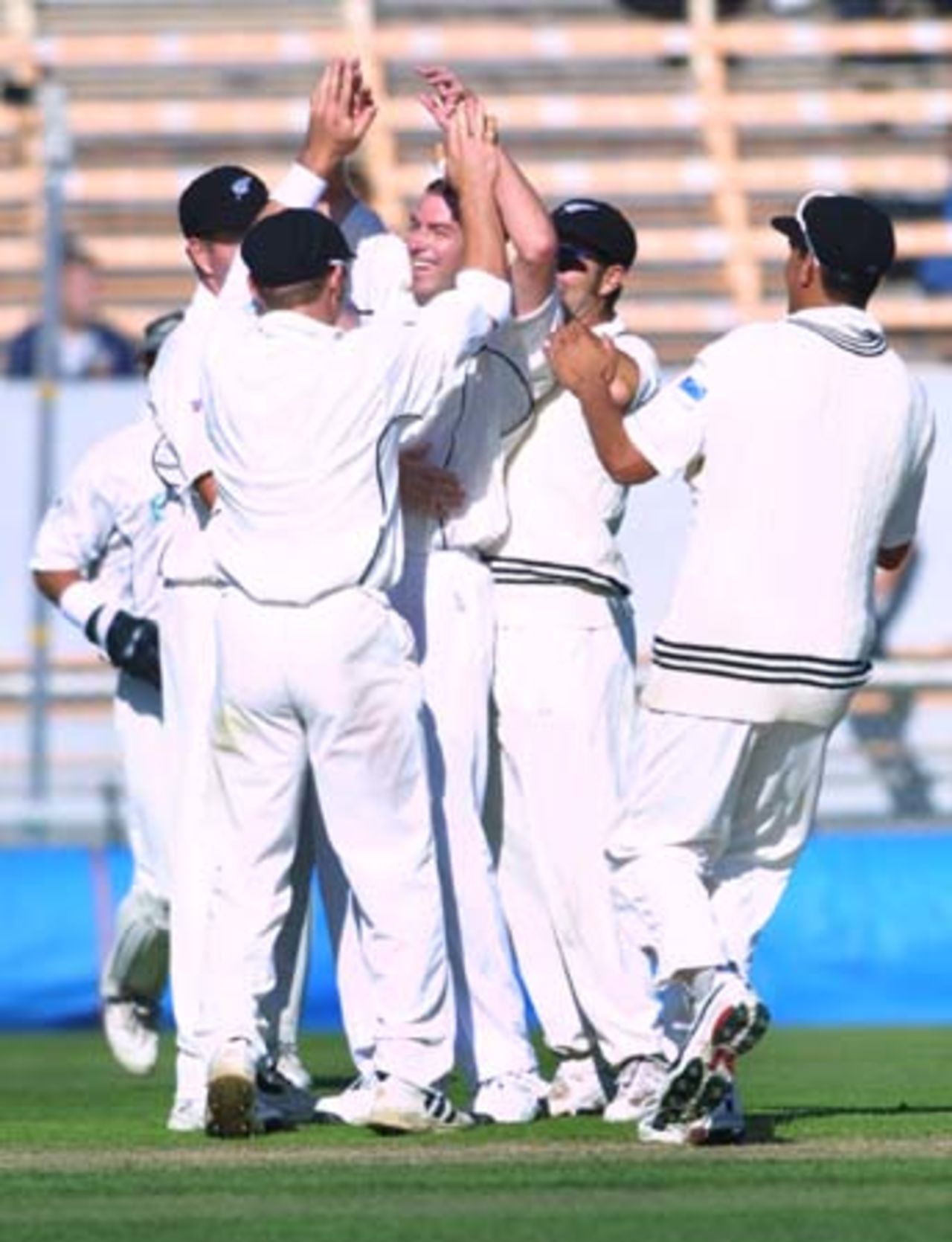 New Zealand fast medium bowler Chris Drum is congratulated by team-mates upon taking his maiden Test wicket on debut. Drum dismissed Pakistan opening batsman Ijaz Ahmed hit wicket for 11 from his first legitimate delivery in Test cricket, after bowling a no-ball. 2nd Test: New Zealand v Pakistan at Jade Stadium, Christchurch, 15-19 March 2001 (16 March 2001).