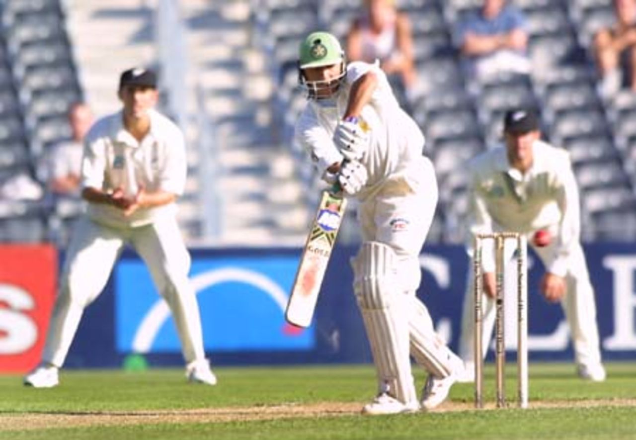 Pakistan batsman Faisal Iqbal plays a ball square on the leg side while New Zealand slip fielders Mathew Sinclair and Nathan Astle look on in the background. Faisal ended the second day's play on 22 not out. 2nd Test: New Zealand v Pakistan at Jade Stadium, Christchurch, 15-19 March 2001 (16 March 2001).