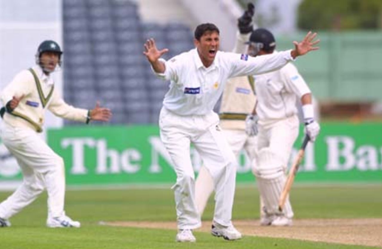 Pakistan leg spinner Younis Khan unsuccessfully appeals for leg before wicket against New Zealand batsman Adam Parore to umpire Daryl Harper during his first innings bowling spell of 0-15 from six overs. Fielder Faisal Iqbal and wicket-keeper Moin Khan (obscured) join in the appeal in the background. 2nd Test: New Zealand v Pakistan at Jade Stadium, Christchurch, 15-19 March 2001 (16 March 2001).