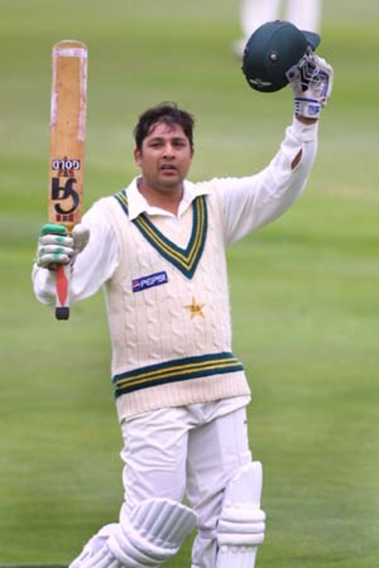 Pakistan batsman Inzamam-ul-Haq raises his bat and his helmet in celebration of reaching his 13th Test century. Inzamam went on to score 130 in his first innings. 2nd Test: New Zealand v Pakistan at Jade Stadium, Christchurch, 15-19 March 2001 (17 March 2001).