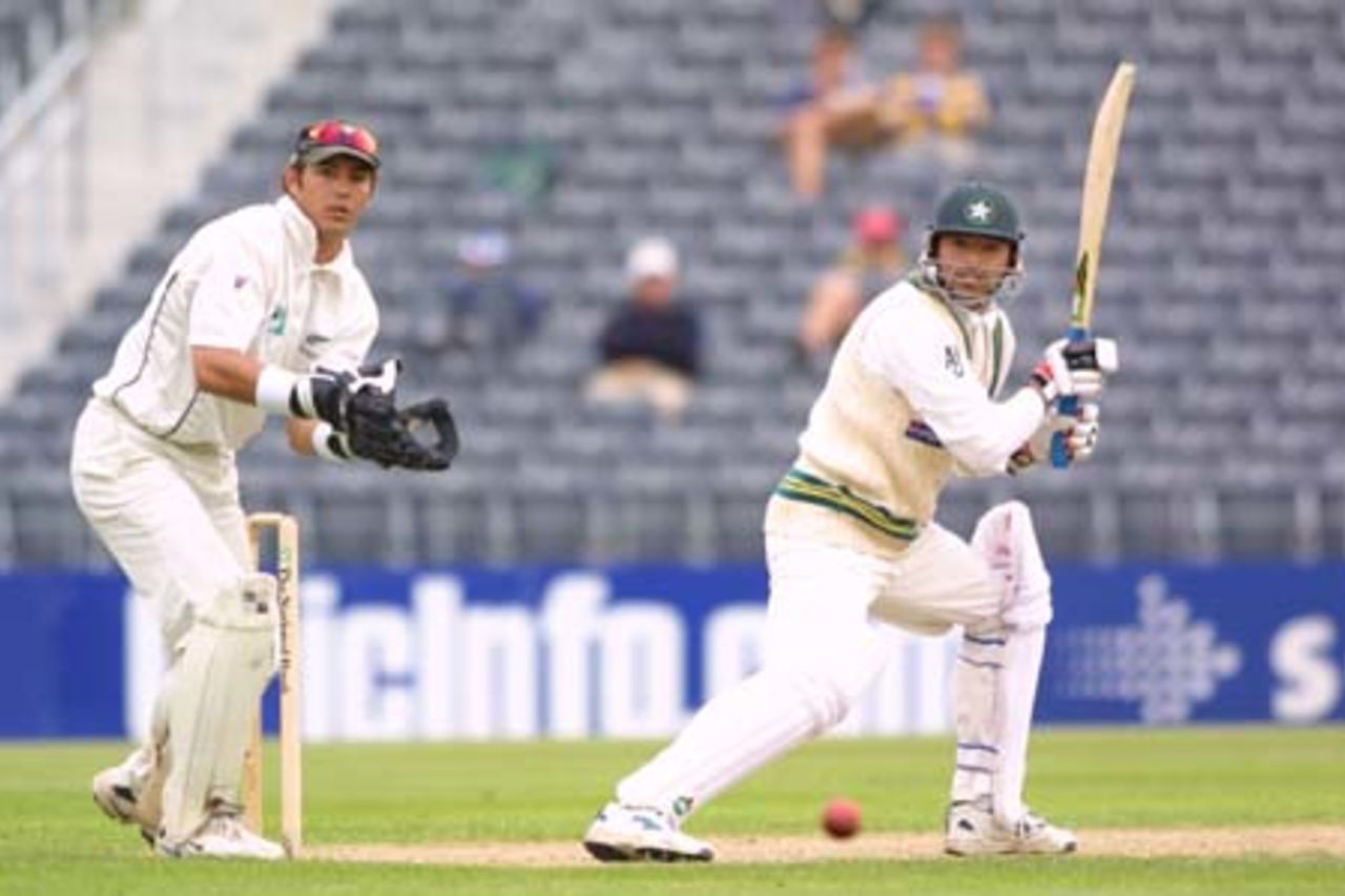 Pakistan lower order batsman Saqlain Mushtaq cuts a ball backward of point while New Zealand wicket-keeper Adam Parore looks on. Saqlain ended the third day's play on 20 not out. 2nd Test: New Zealand v Pakistan at Jade Stadium, Christchurch, 15-19 March 2001 (17 March 2001).