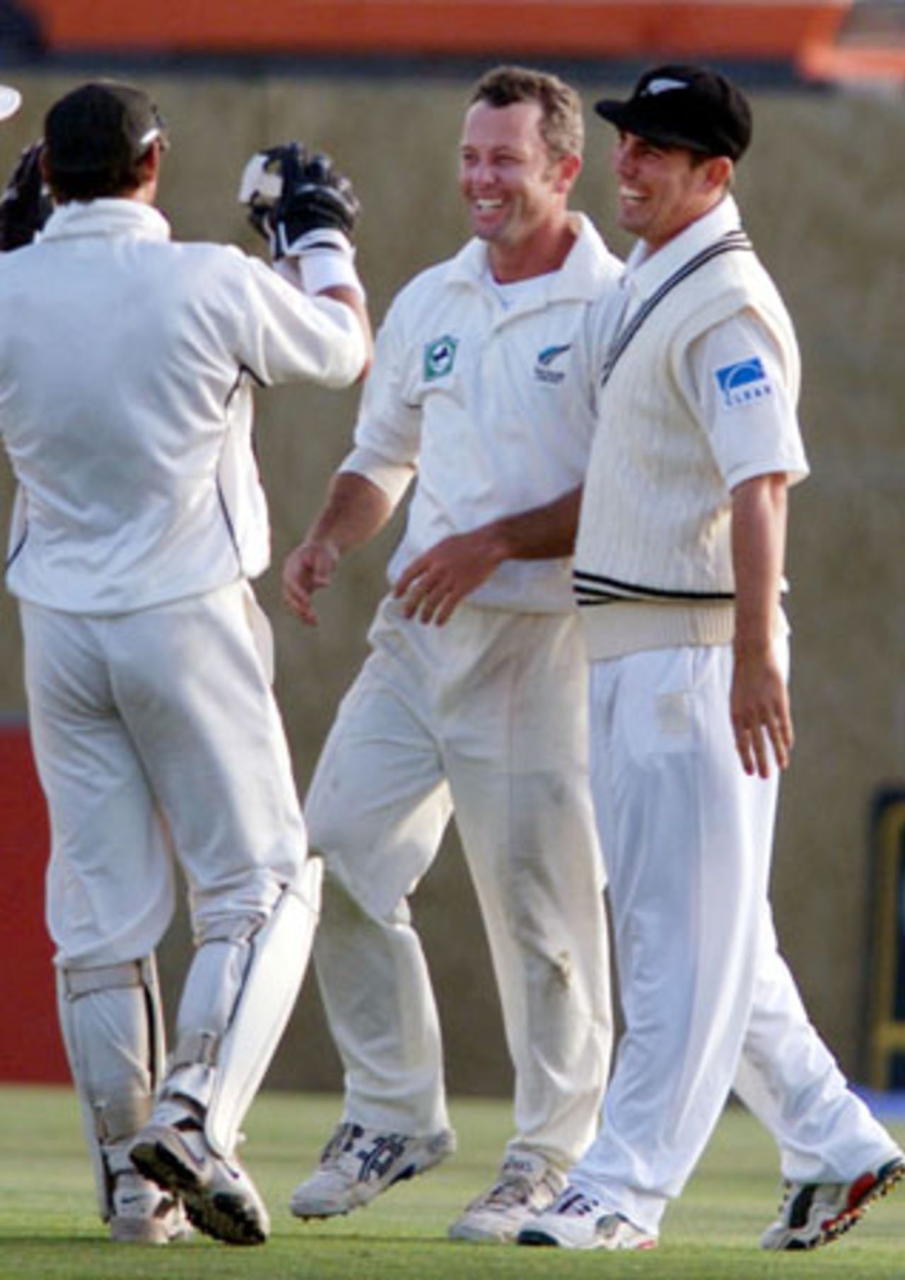 New Zealand slow left arm orthodox spinner Mark Richardson celebrates with team-mates Adam Parore (left) and Mathew Sinclair after taking the wicket of Pakistan batsman Yousuf Youhana, caught and bowled for 203. Yousuf is Richardson's first Test wicket. 2nd Test: New Zealand v Pakistan at Jade Stadium, Christchurch, 15-19 March 2001 (18 March 2001).