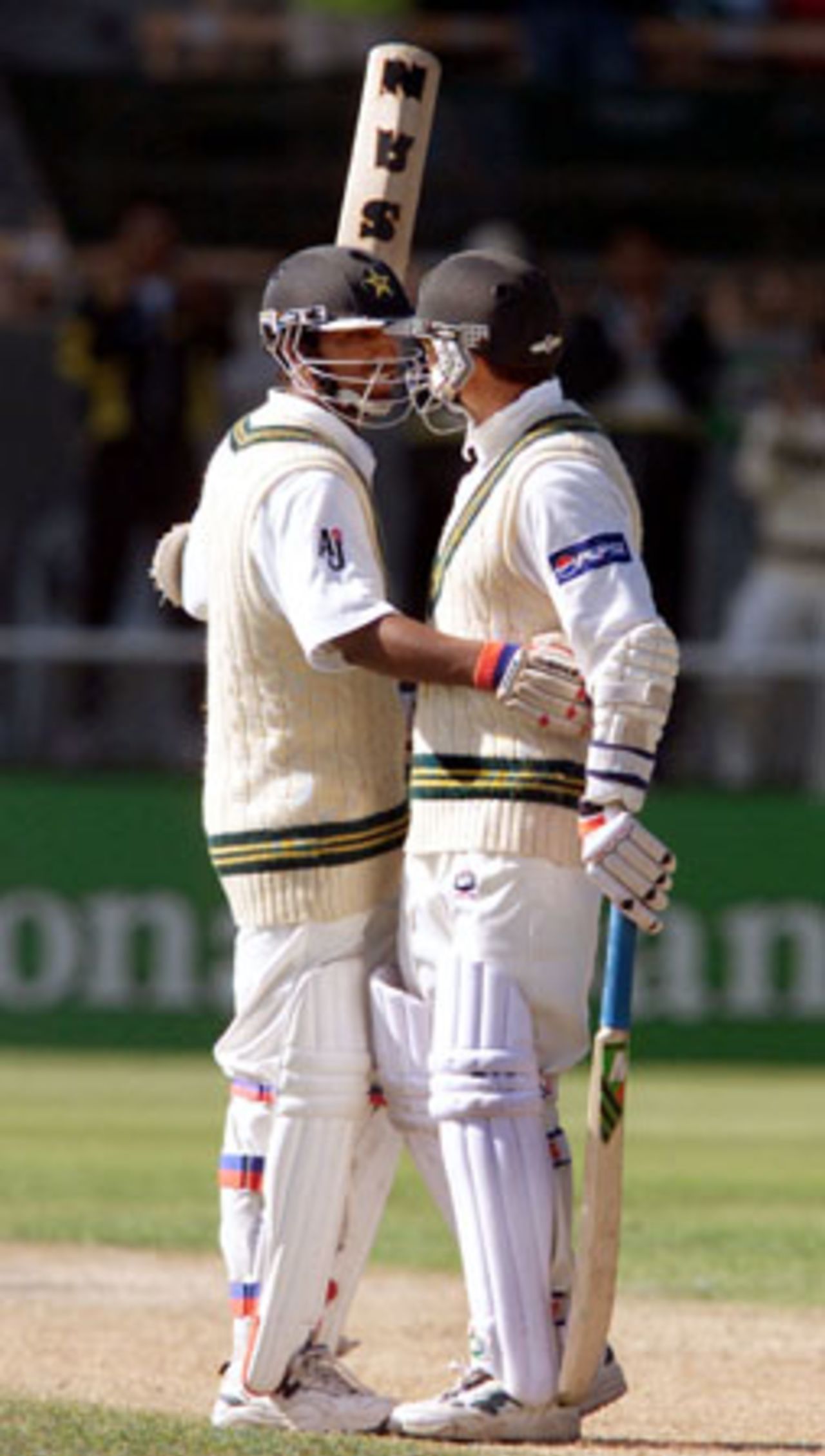 Pakistan batsman Yousuf Youhana is embraced by batting partner Saqlain Mushtaq upon reaching 150. Yousuf went on to score 203. It is his sixth Test century and highest first-class score. Yousuf and Saqlain shared in a seventh wicket partnership of 248. 2nd Test: New Zealand v Pakistan at Jade Stadium, Christchurch, 15-19 March 2001 (18 March 2001).