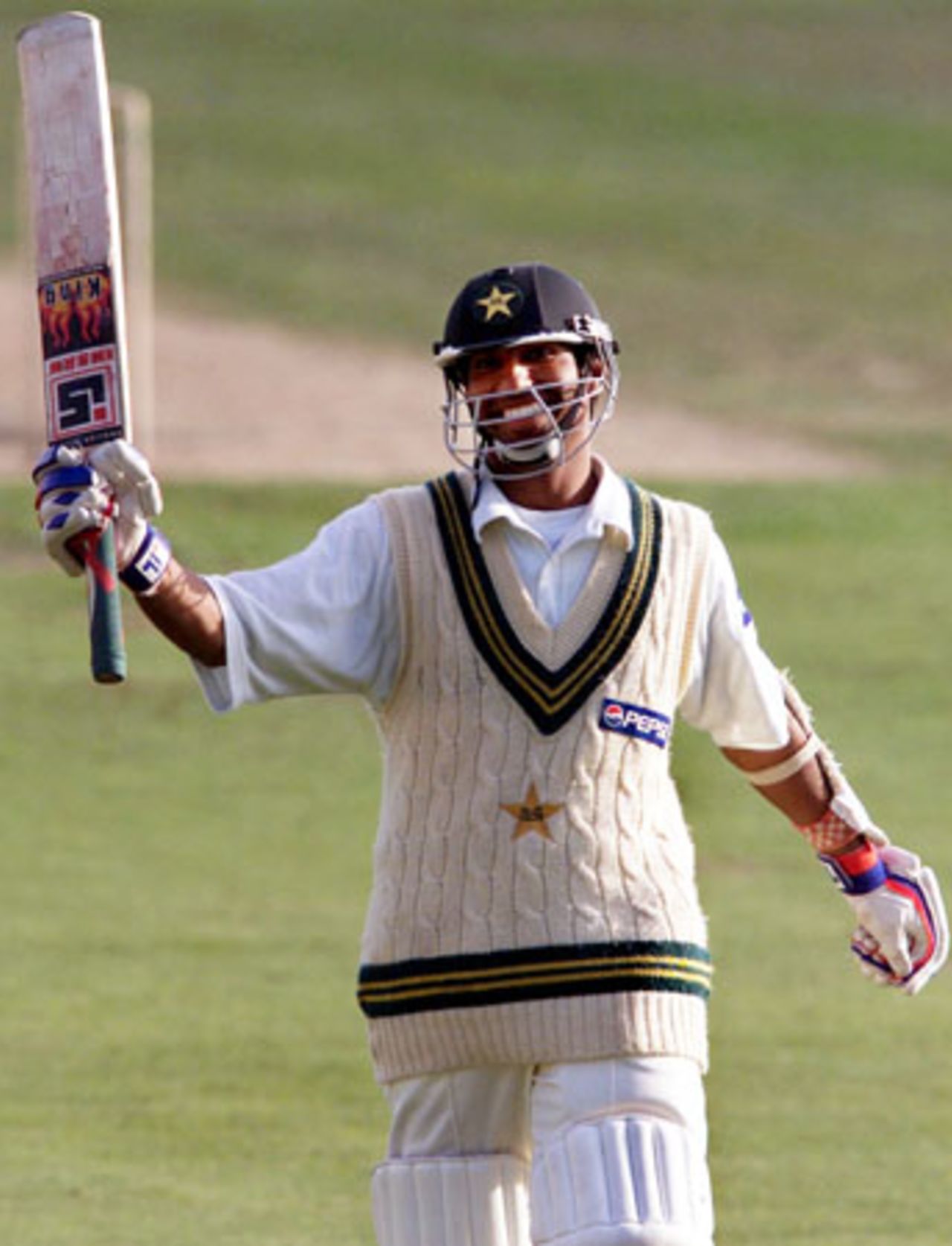 Pakistan batsman Yousuf Youhana raises his bat in celebration upon reaching 200. Yousuf went on to score 203. It is his sixth Test century and highest first-class score. 2nd Test: New Zealand v Pakistan at Jade Stadium, Christchurch, 15-19 March 2001 (18 March 2001).