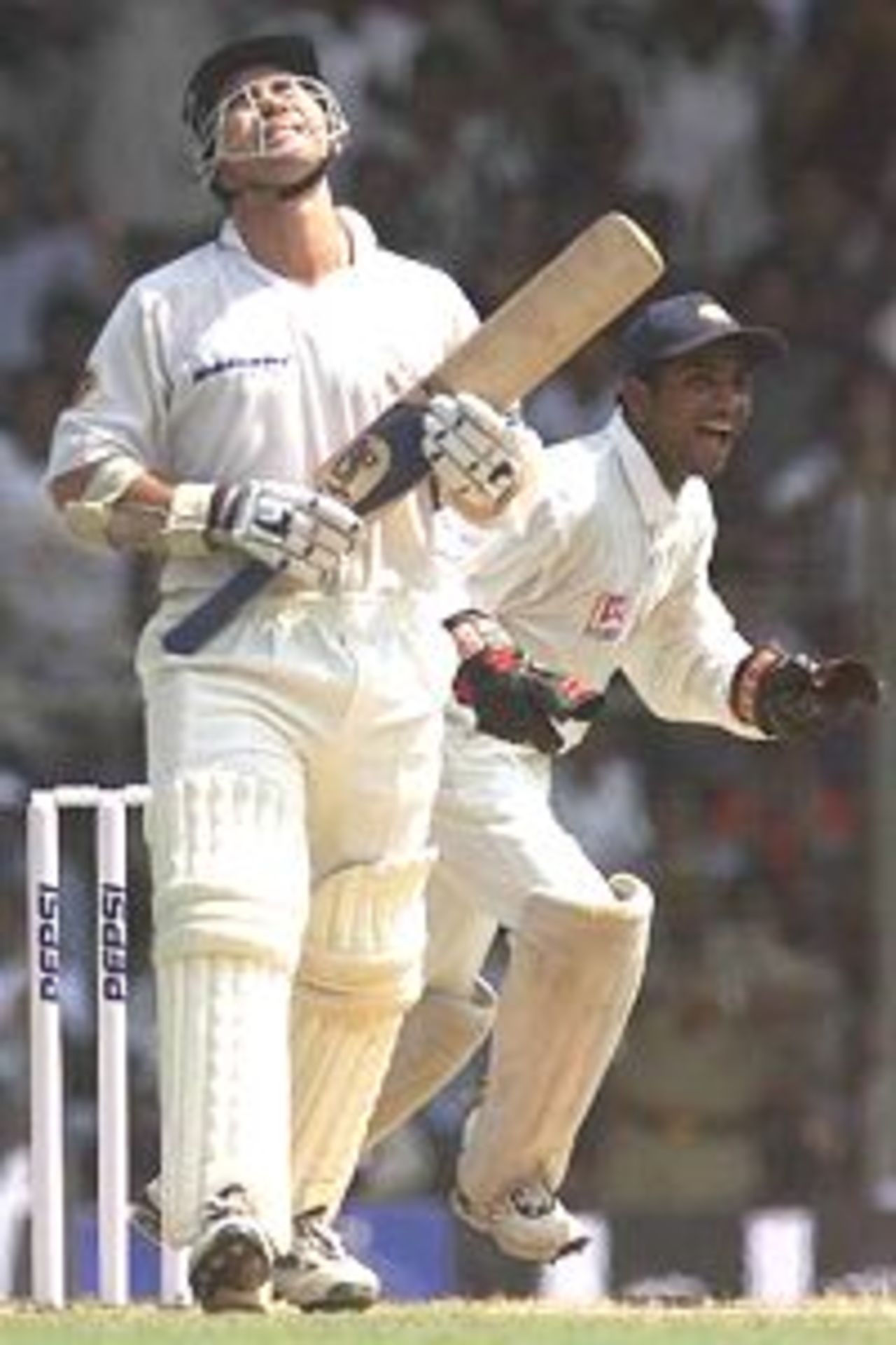 Justin Langer of Australia shows his disappointment at going out as Same Dighe of India celebrates, during day one of the third test between India and Australia at Chepauk Stadium, Chennai, India.