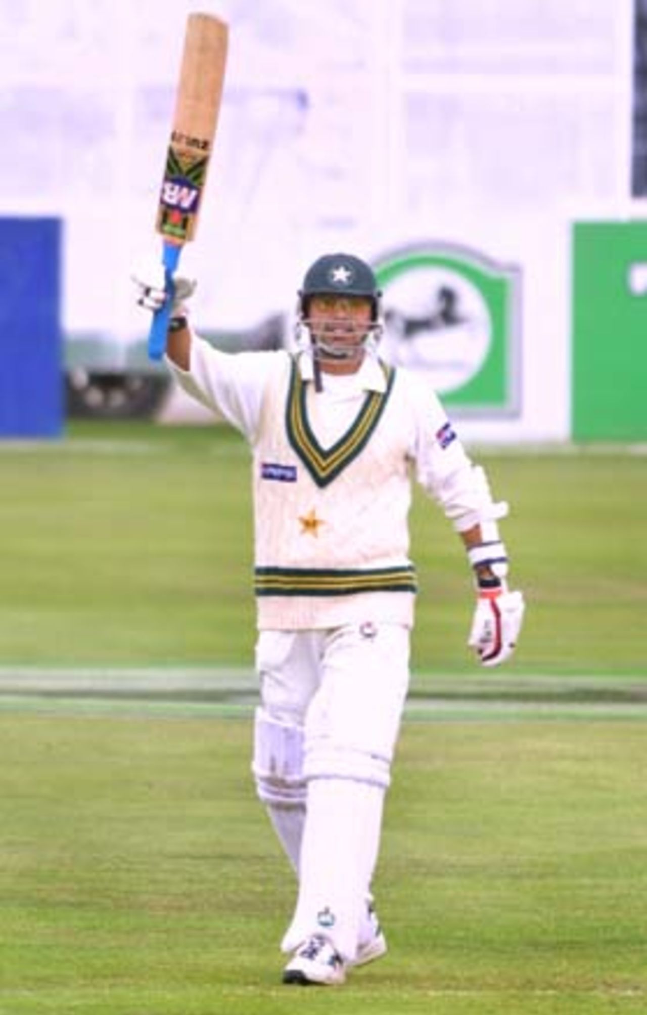 Pakistan lower order batsman Saqlain Mushtaq raises his bat in celebration of reaching his maiden Test century. Saqlain went on to score 101 not out before Pakistan declared their first innings at 571/8. 2nd Test: New Zealand v Pakistan at Jade Stadium, Christchurch, 15-19 March 2001 (19 March 2001).