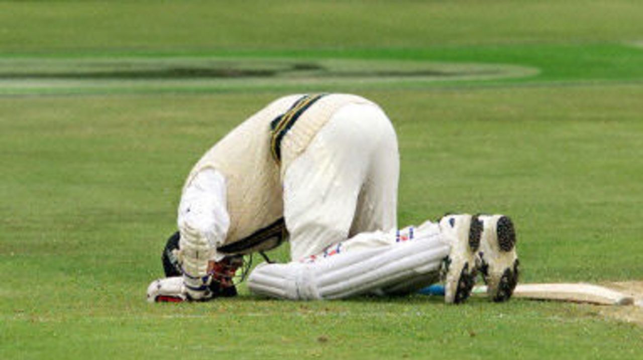 Pakistan batsman Saqlain Mushtaq kneels towards the Holy City of Mecca after scoring his first century on the final day of the second Test Match being played in Christchurch 19 March 2001.