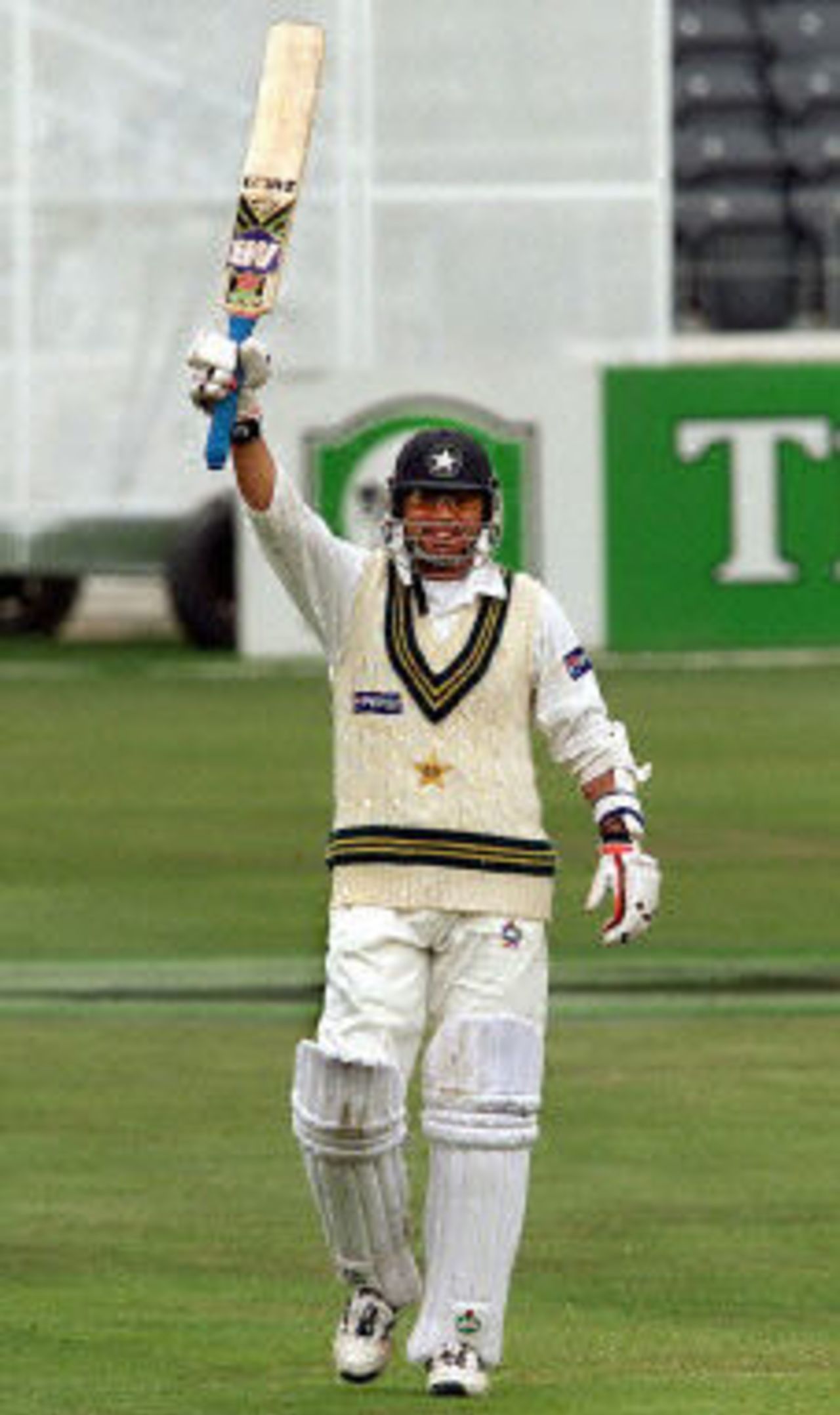 Pakistan batsman Saqlain Mushtaq celebrates scoring his first test century, day 5, 2nd Test at Christchurch, 15-19 March 2001.