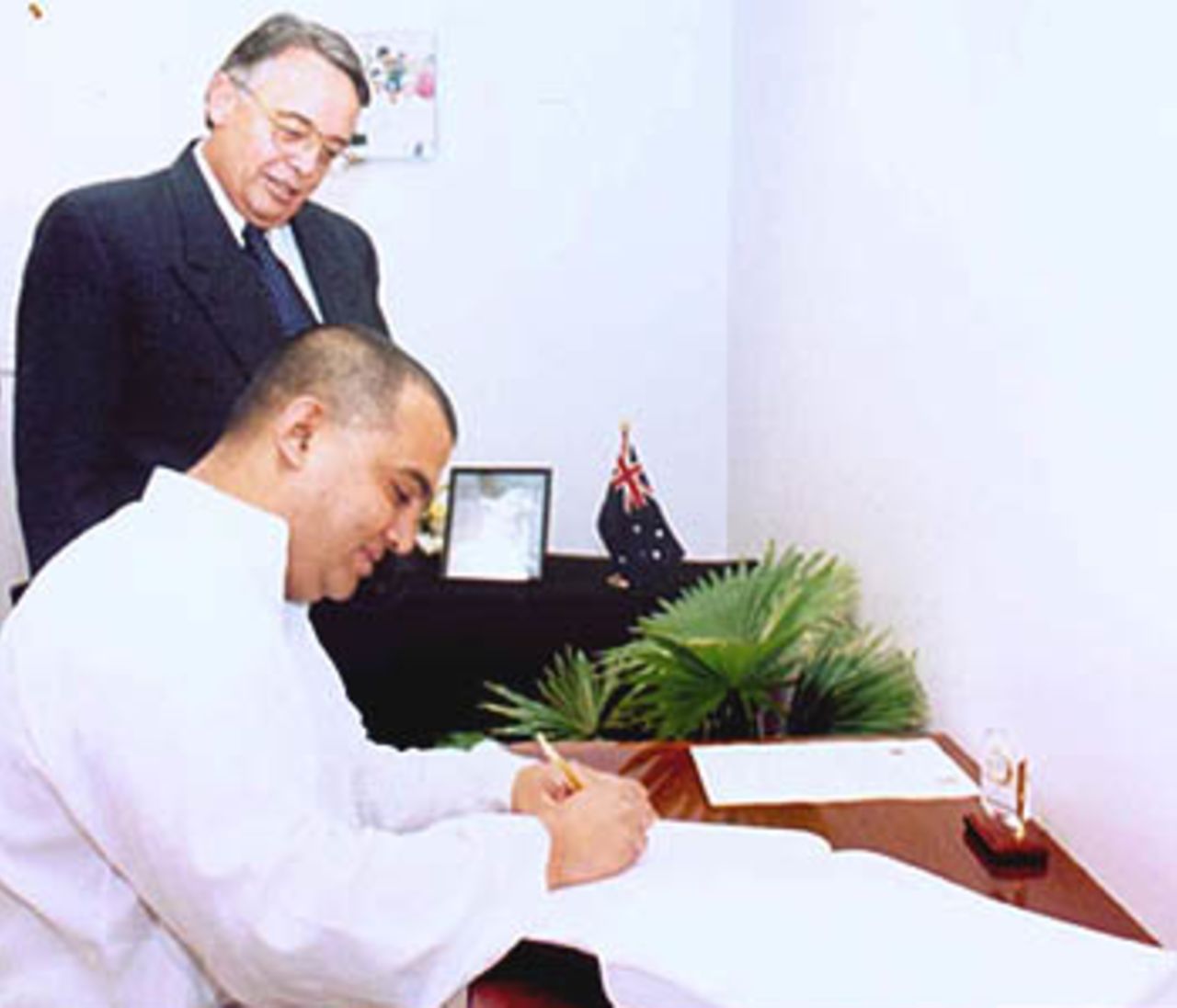 BCB President Saber Hossain Chowdhury signs a condolence book on Sir Donald Bradman, 19 March 2001.