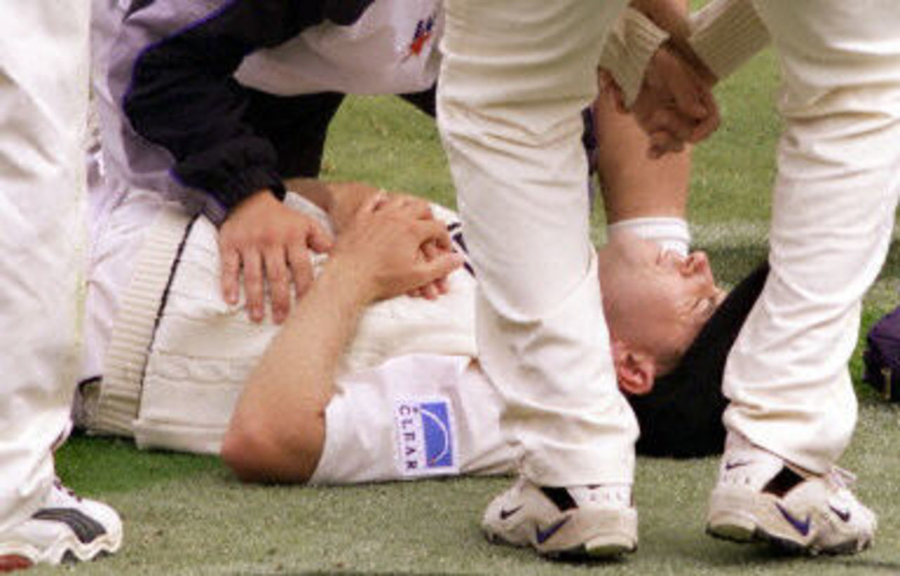 Chris Drum lies on the ground in pain after dislocating a joint in his shoulder, day 2, 2nd Test at Christchurch, 15-19 March 2001.