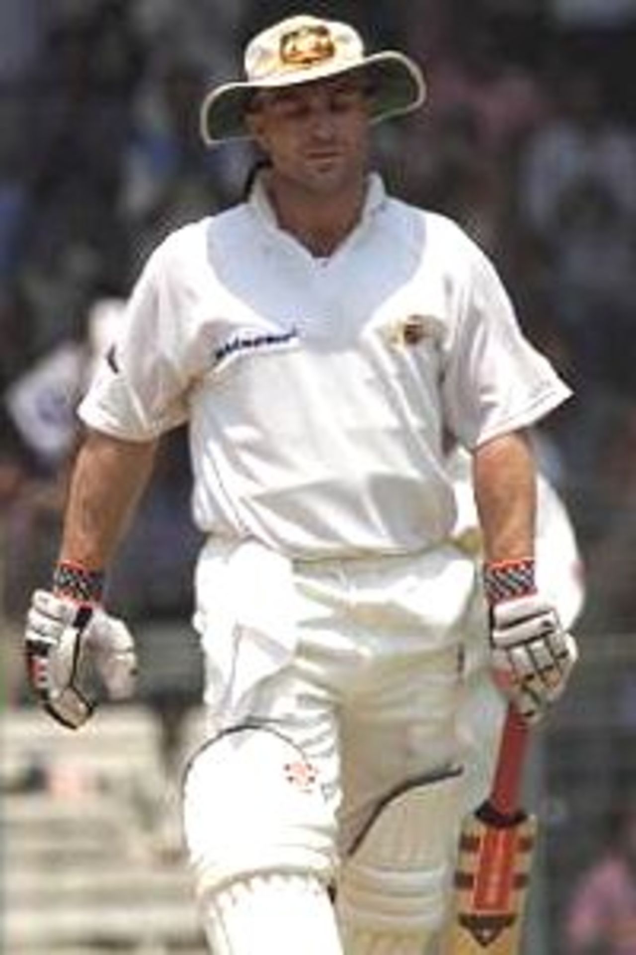 Michael Slater of Australia leaves the field after being dismissed by Harbhajan Singh of India for 48, during day four of the third test between India and Australia at the M.A. Chidambaram Stadium, Chennai, India.