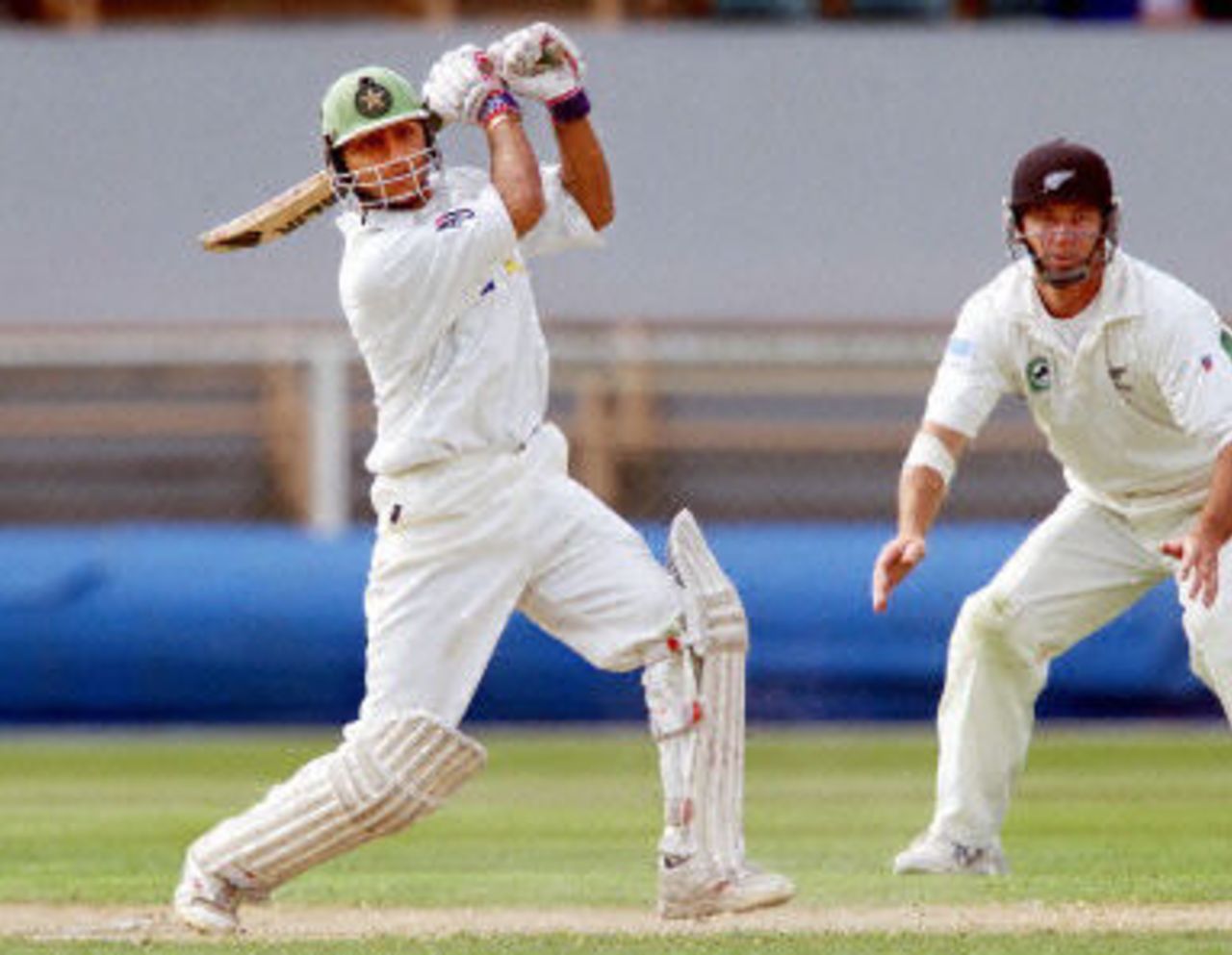Faisal Iqbal cracks a ball to the boundary as Mark Richardson looks on, day 3, 2nd Test at Christchurch, 15-19 March 2001.