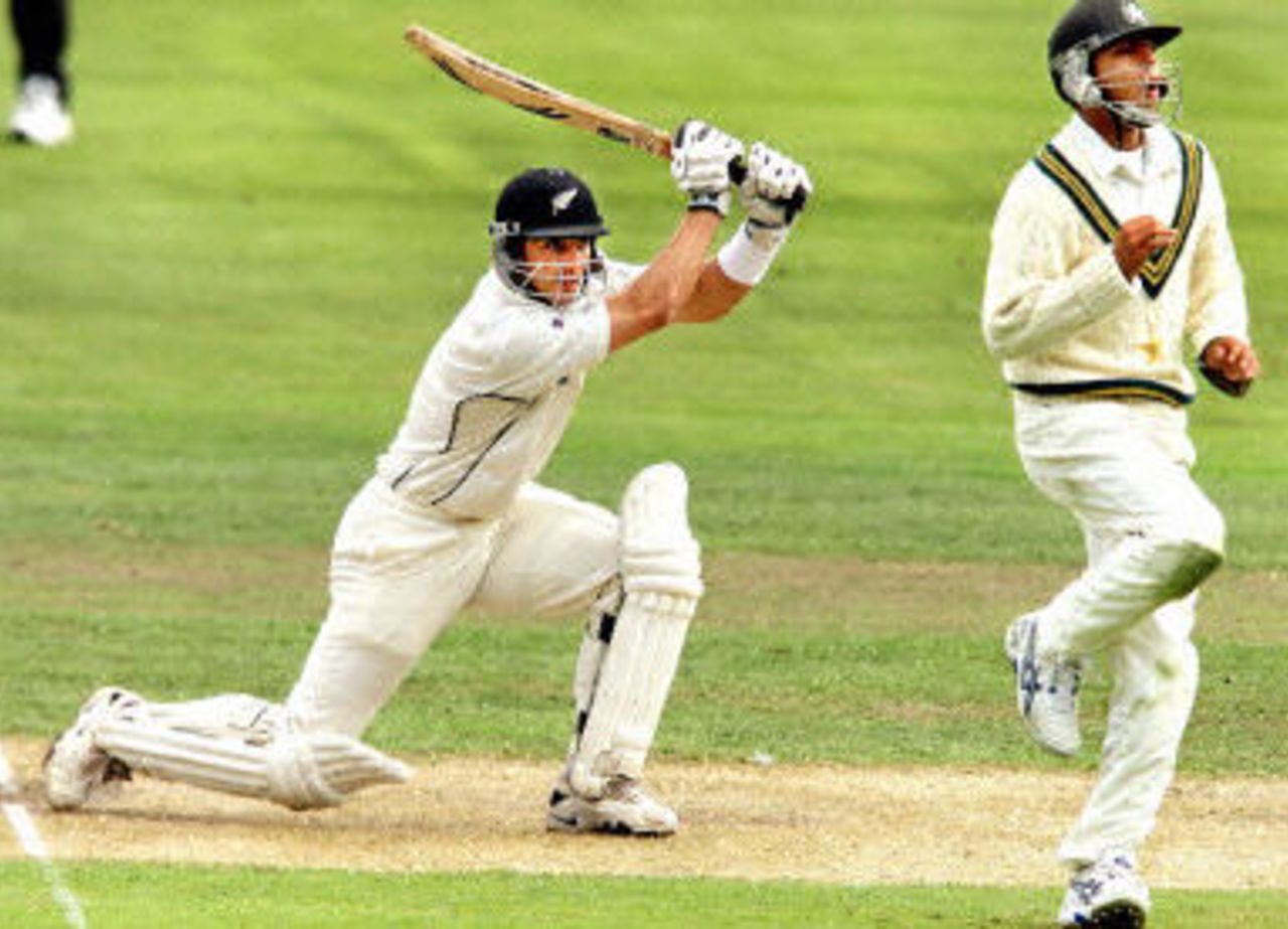 Adam Parore drives the ball into Faisal Iqbal, day 2, 2nd Test at Christchurch, 15-19 March 2001.