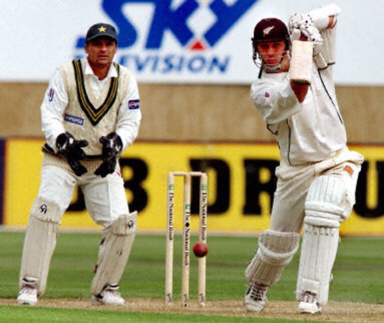 Mathew Sinclair drives a ball towards the boundary on the way to his double century as Moin Khan looks on, day 2, 2nd Test at Christchurch, 15-19 March 2001.