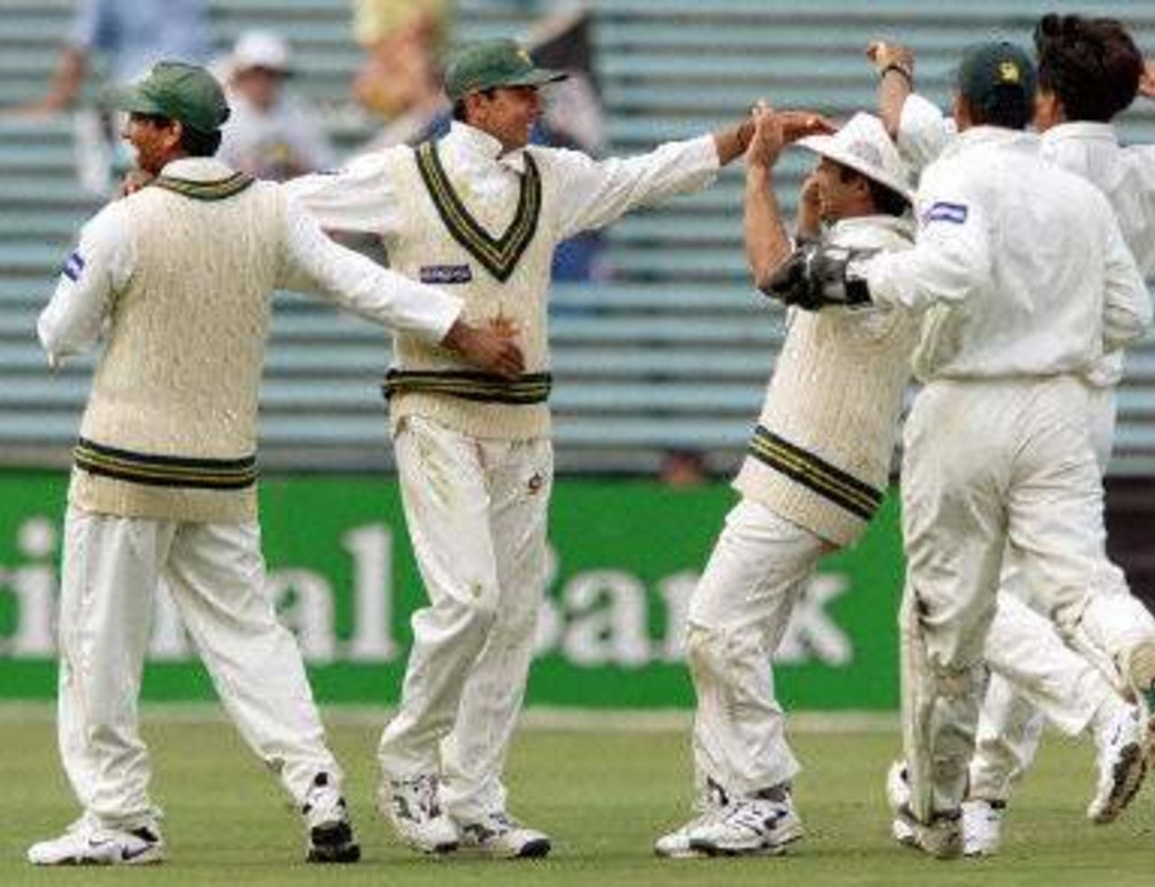 Saqlain Mushtaq being congratulated after taking a sensational catch dismissing Craig McMillan, day 5, 1st Test at Eden Park in Auckland, 8-12 March 2001.